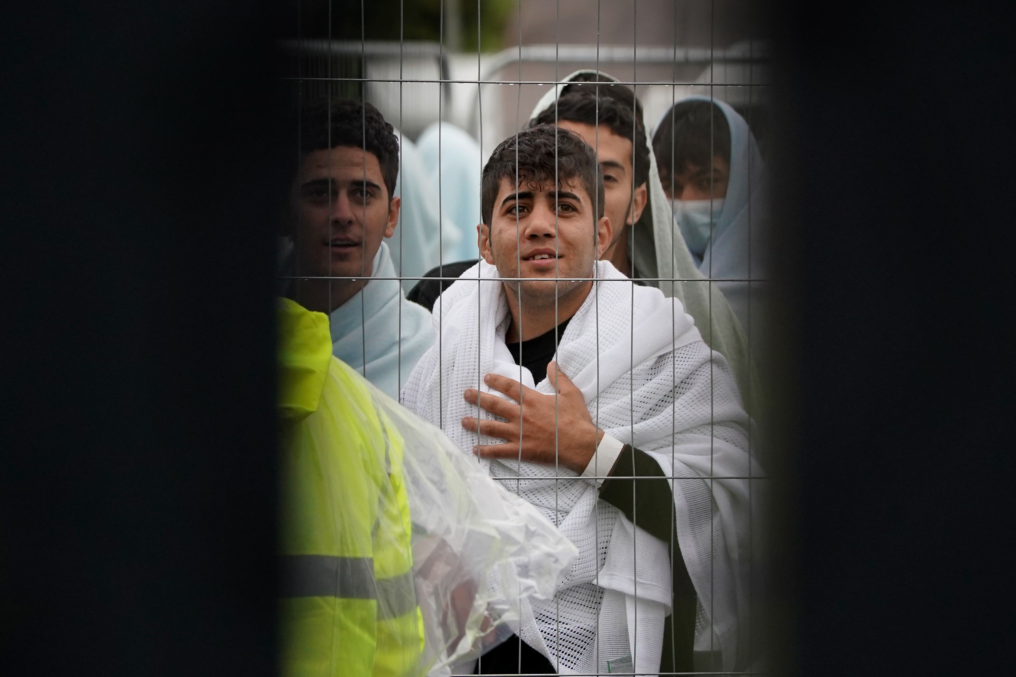 A view of people thought to be migrants inside the Manston immigration short-term holding facility (Gareth Fuller/PA)