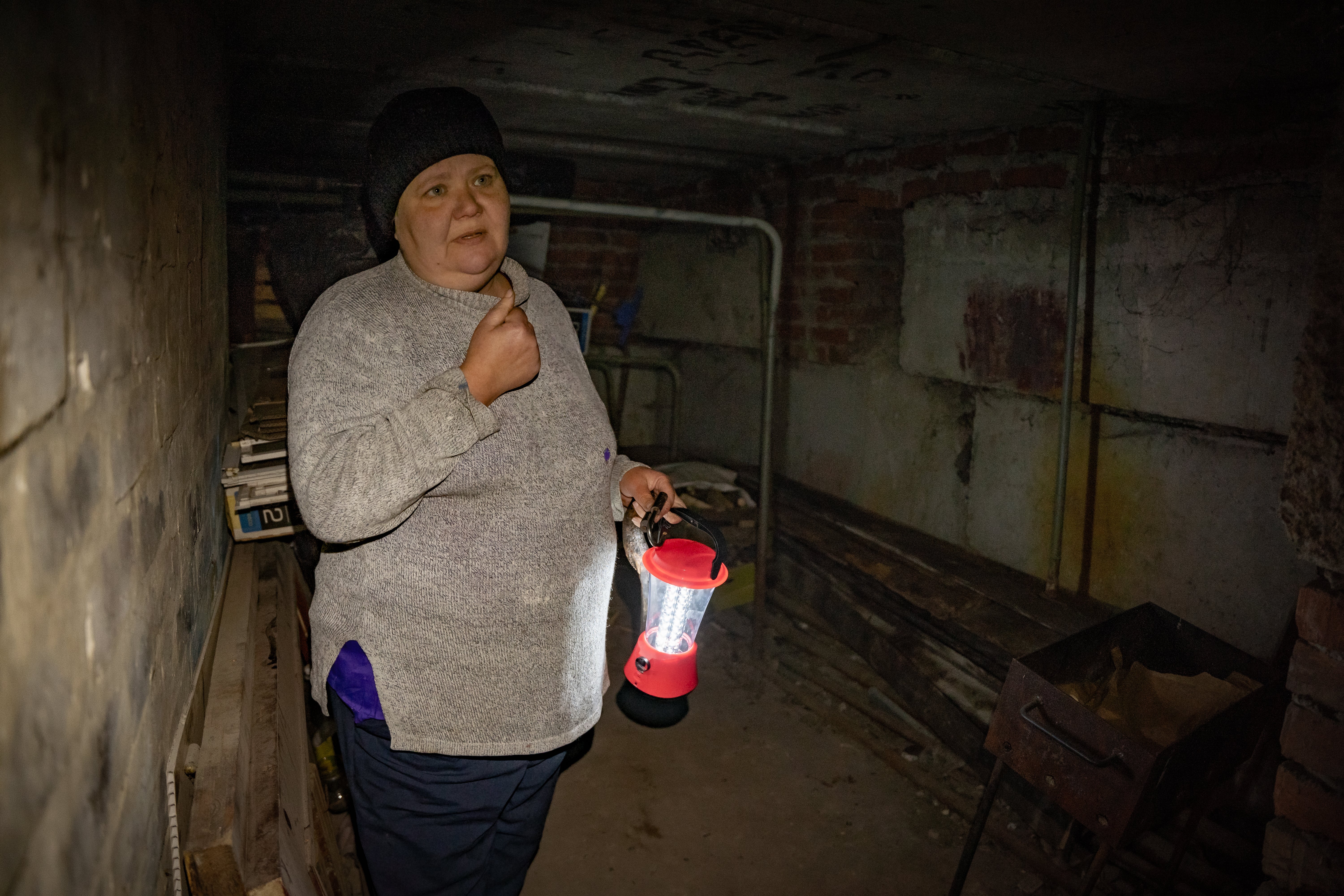 Yelena shows where she lived for seven months underground with her diabetic and infirm mother in Lyman