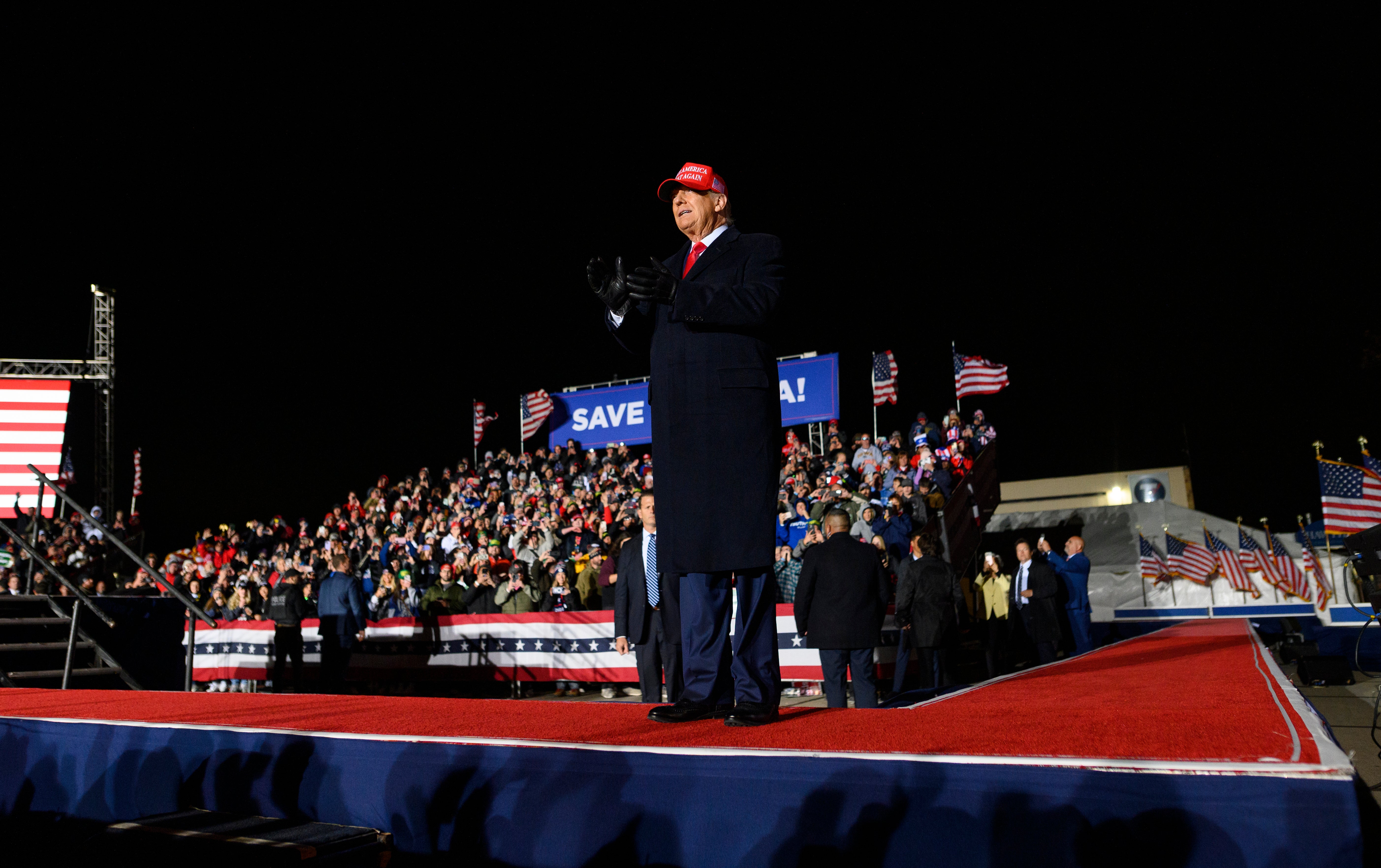 Former president Donald Trump arrives at a campaign event at Sioux Gateway Airport on Thursday