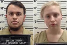 New Mexico couple charged after woman stabbed to death with three-foot metal sword