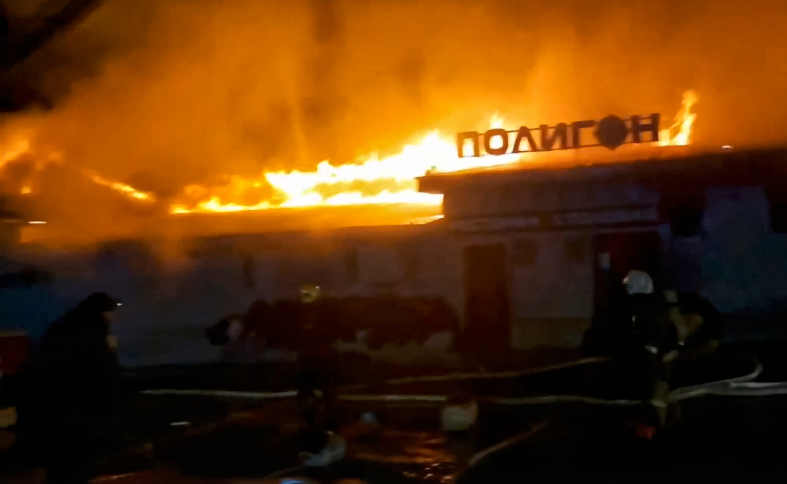 Firefighters fight the blaze at Polygon cafe in Kostroma, Russia