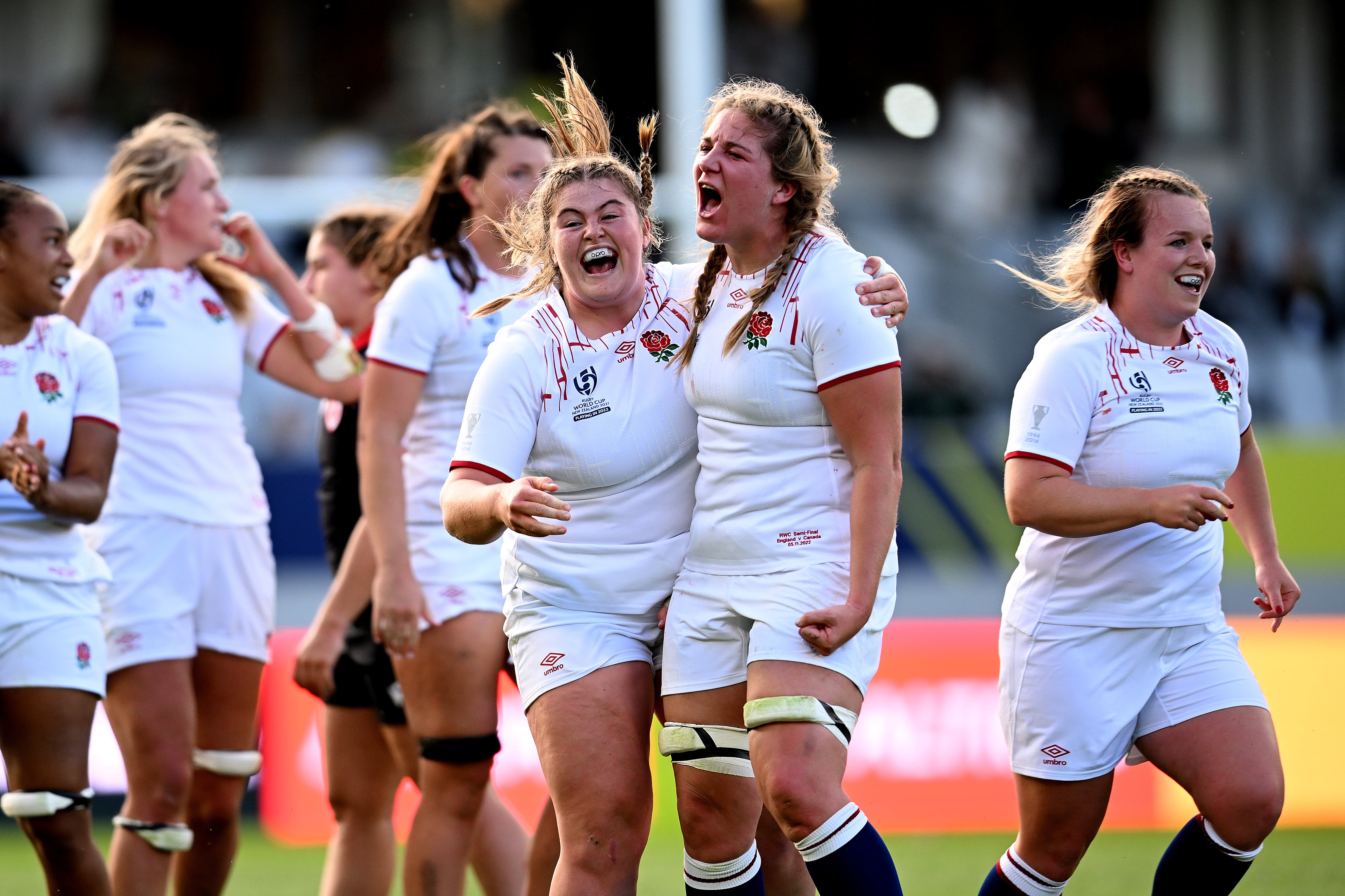 Maud Muir of England and Poppy Cleall celebrate victory over Canada