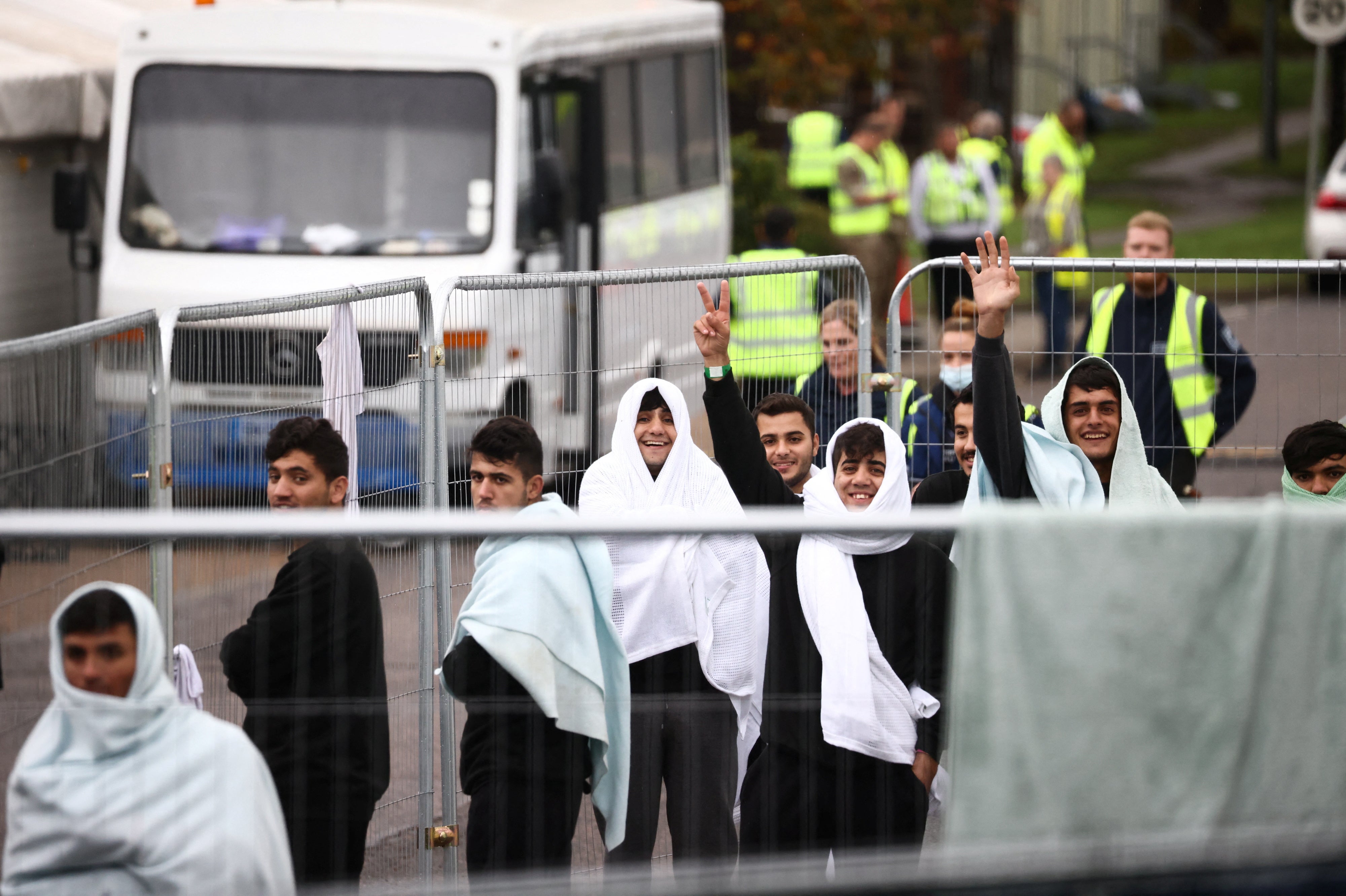 People inside a containment area inside a migrant processing centre in Manston