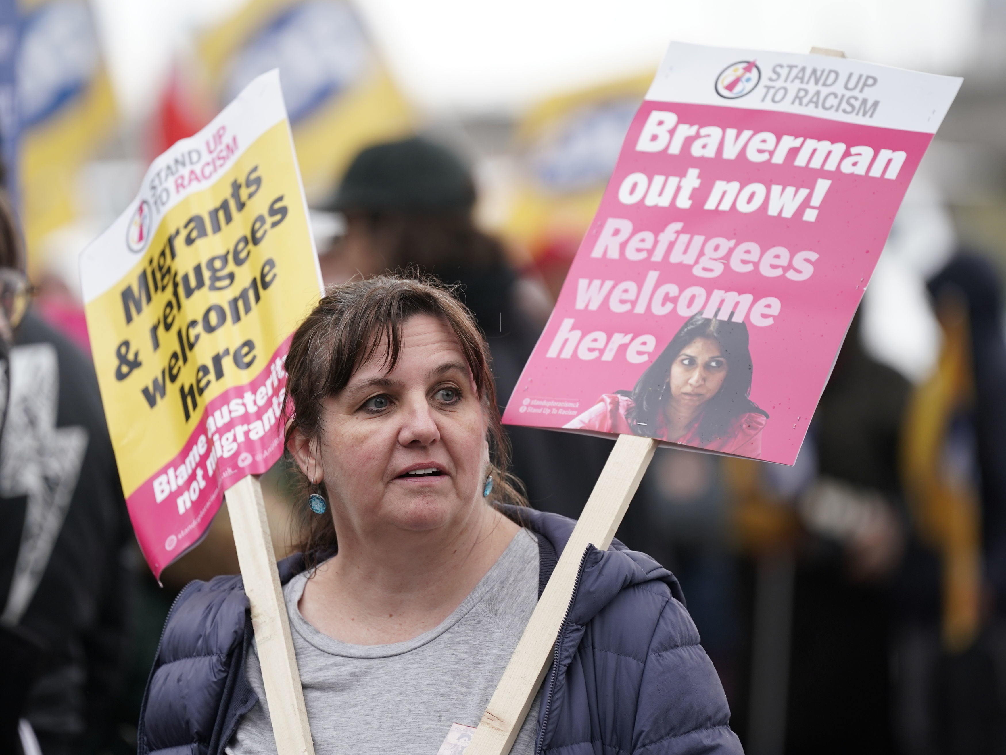 A protester calling for home secretary Suella Braverman to resign