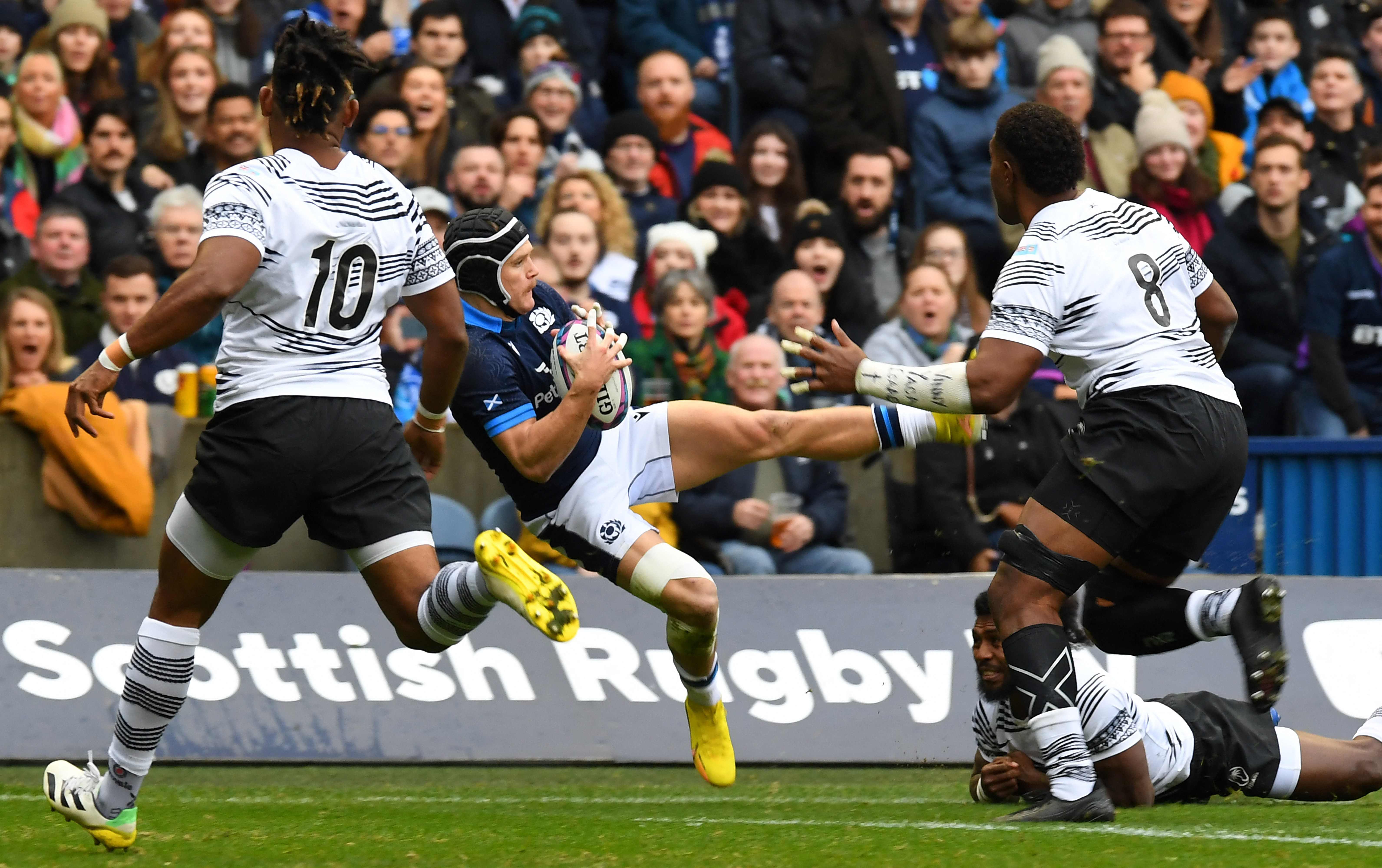 Fiji's scrum-half Frank Lomani (2R) tackles Scotland's wing Darcy Graham during the Autumn Nations Series