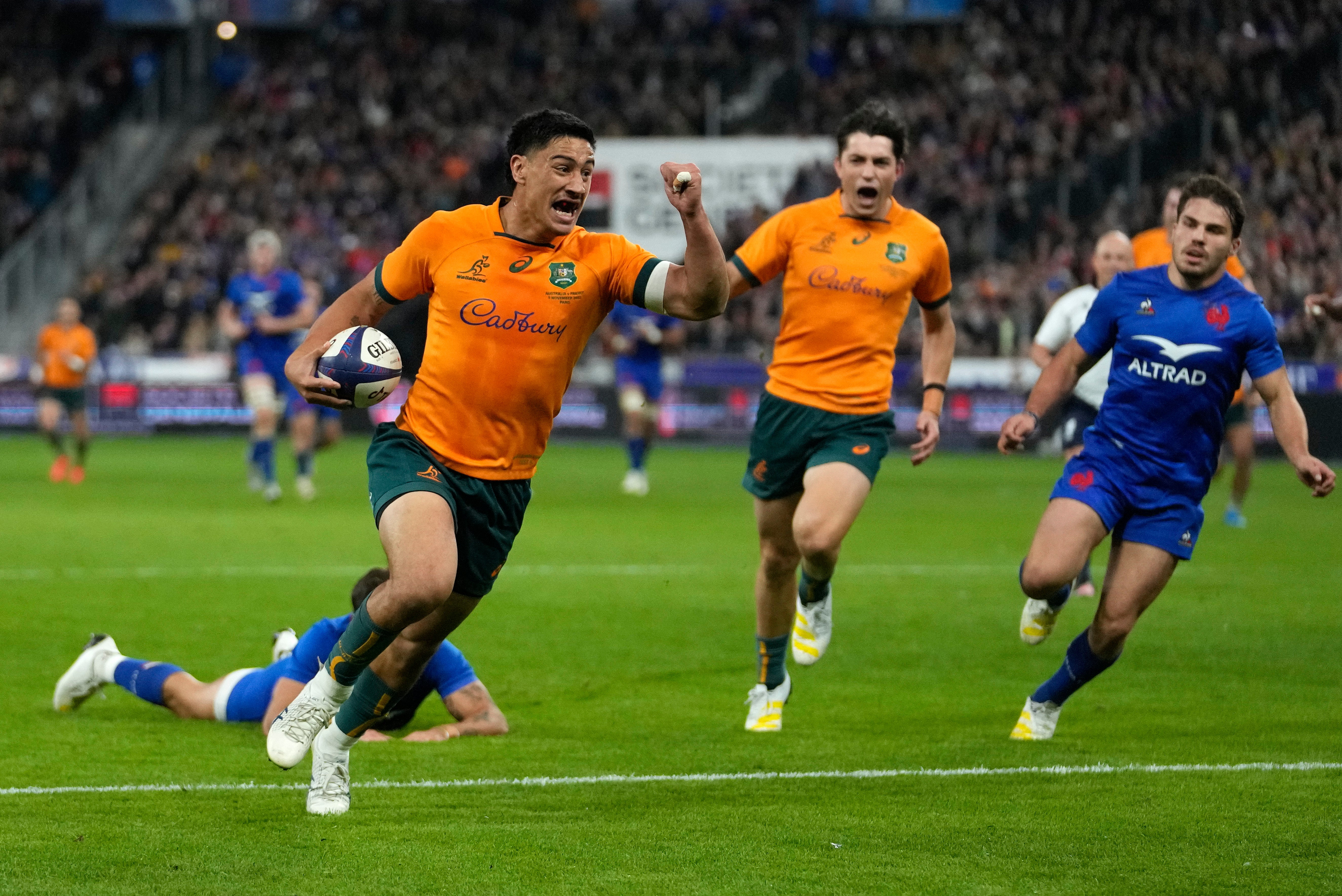 Australia's Lalakai Foketi celebrates as he scores the opening try