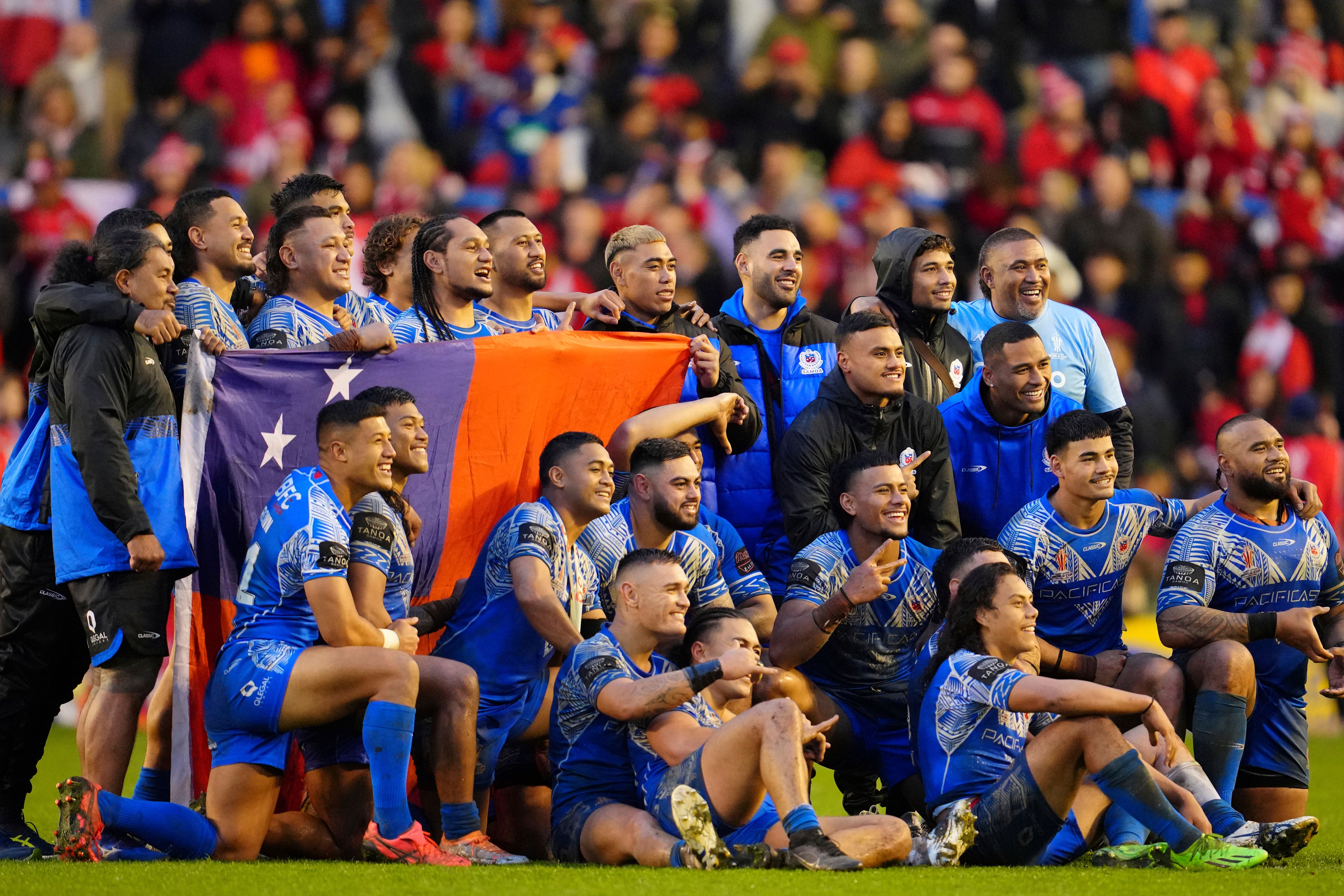 Samoa players after the quarter-final win (Jon Super/AP/PA)