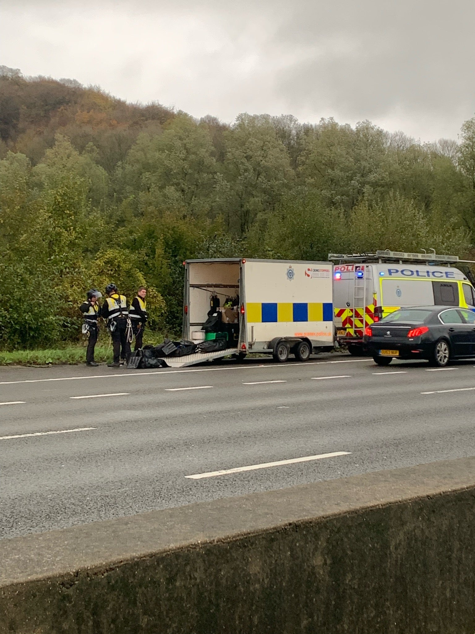 Surrey Police responded to protesters on overhead gantries along the M25