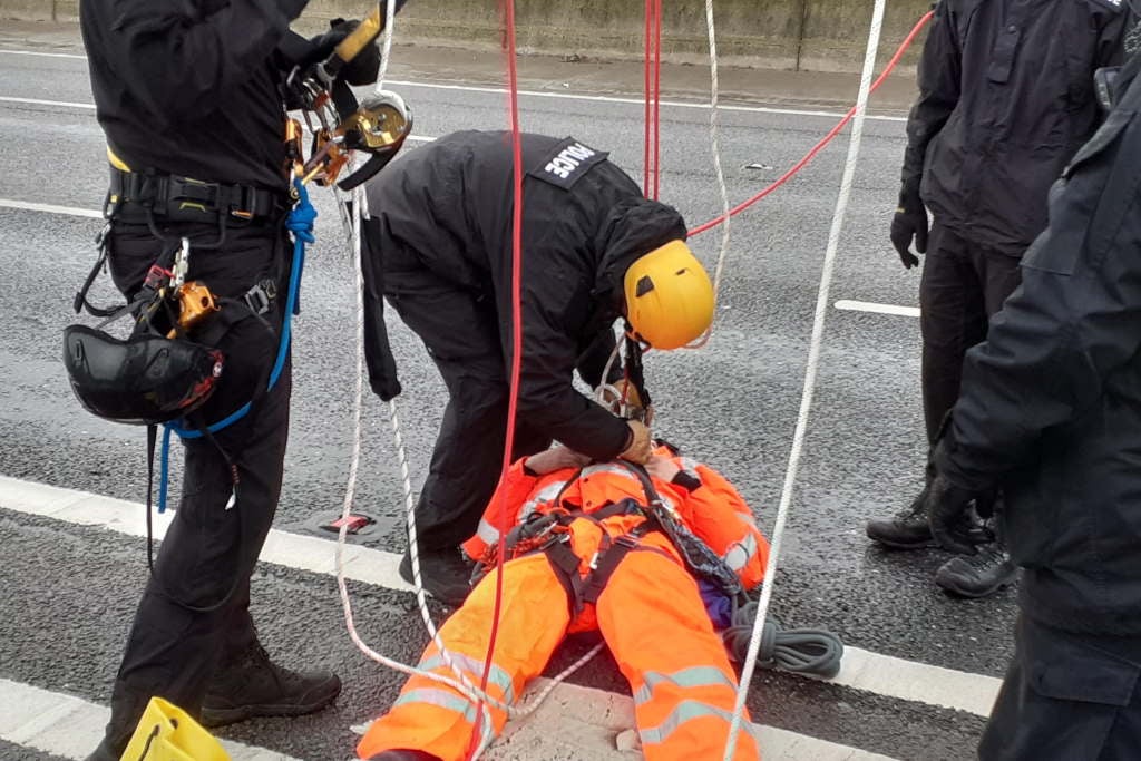 Police removed protesters down from M25 gantries in a protest in early November