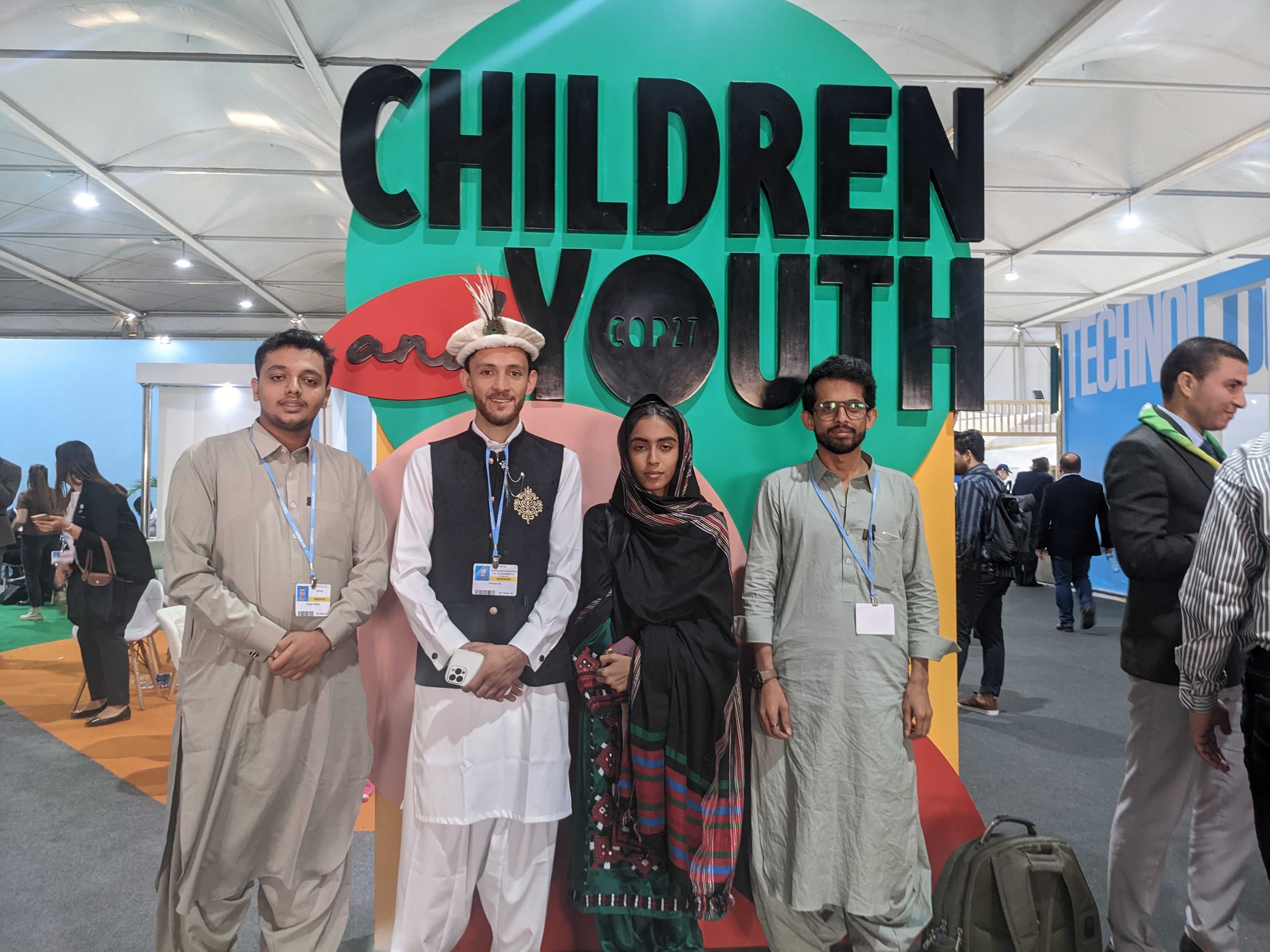 Flood survivors from Pakistan stand at the Youth and Children pavilion at Cop27 summit