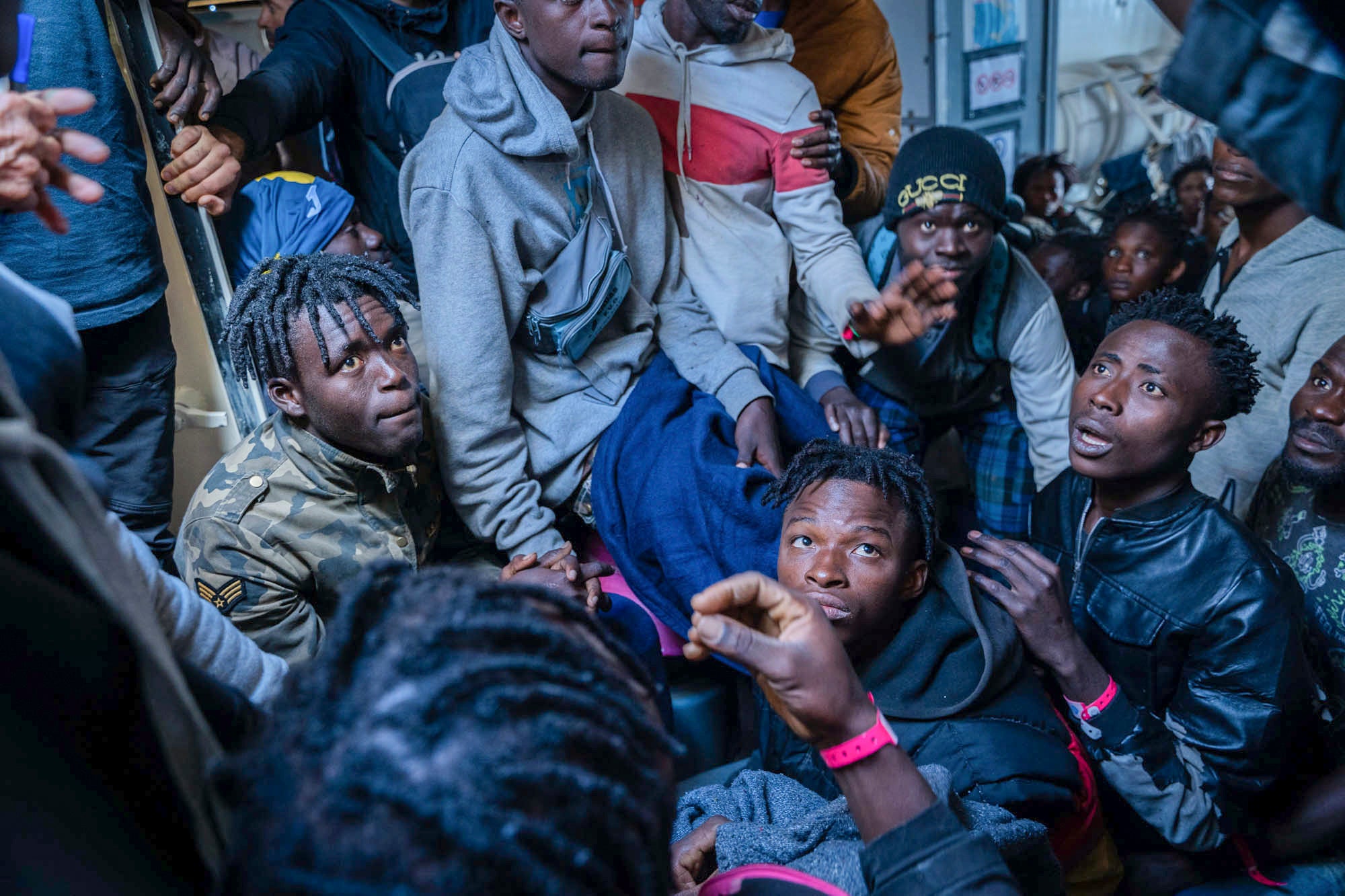 Migrants on the deck of the Rise Above rescue ship run by the German organisation Mission Lifeline