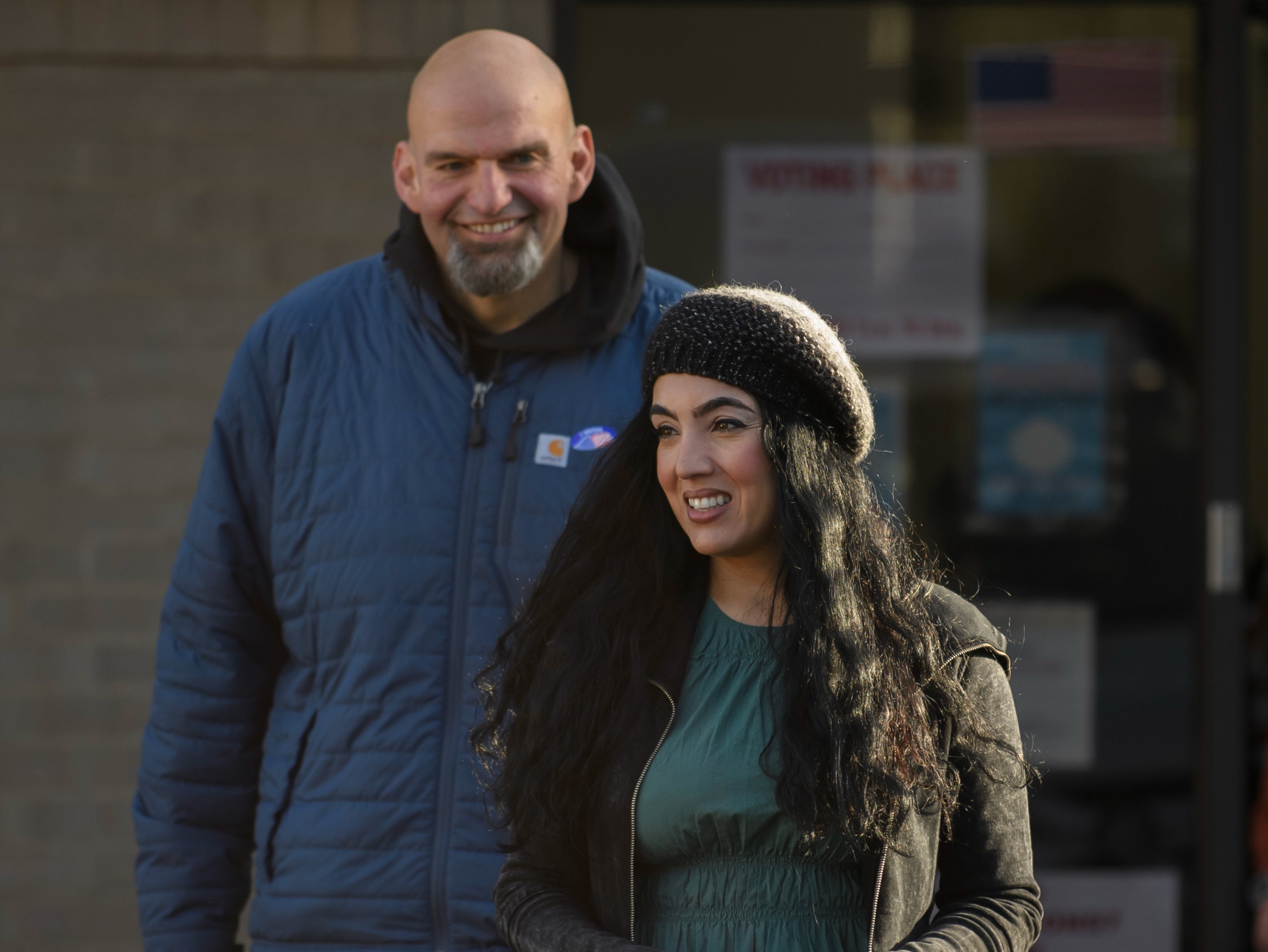 Pennsylvania Democratic Senate candidate John Fetterman and his wife, Gisele, leave their polling place after casting their votes at the New Hope Baptist Church on November 8