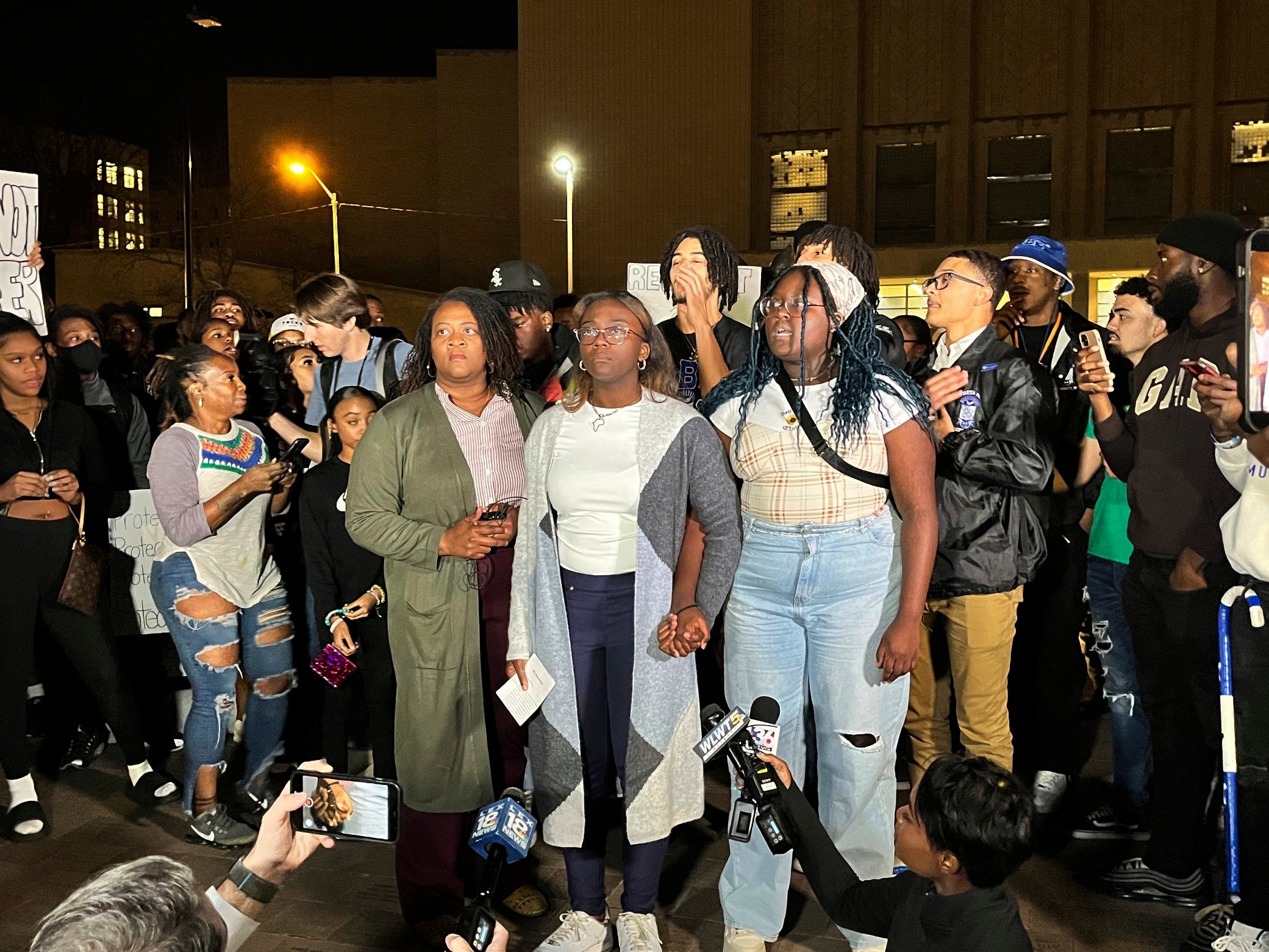 Kylah Spring, center, speaks at a march against racism on University of Kentucky’s campus on Monday