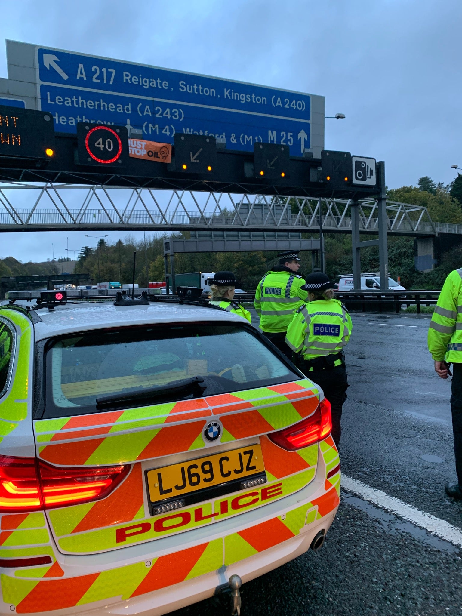 Surrey Police officers along the M25 after making an arrest on Wednesday morning