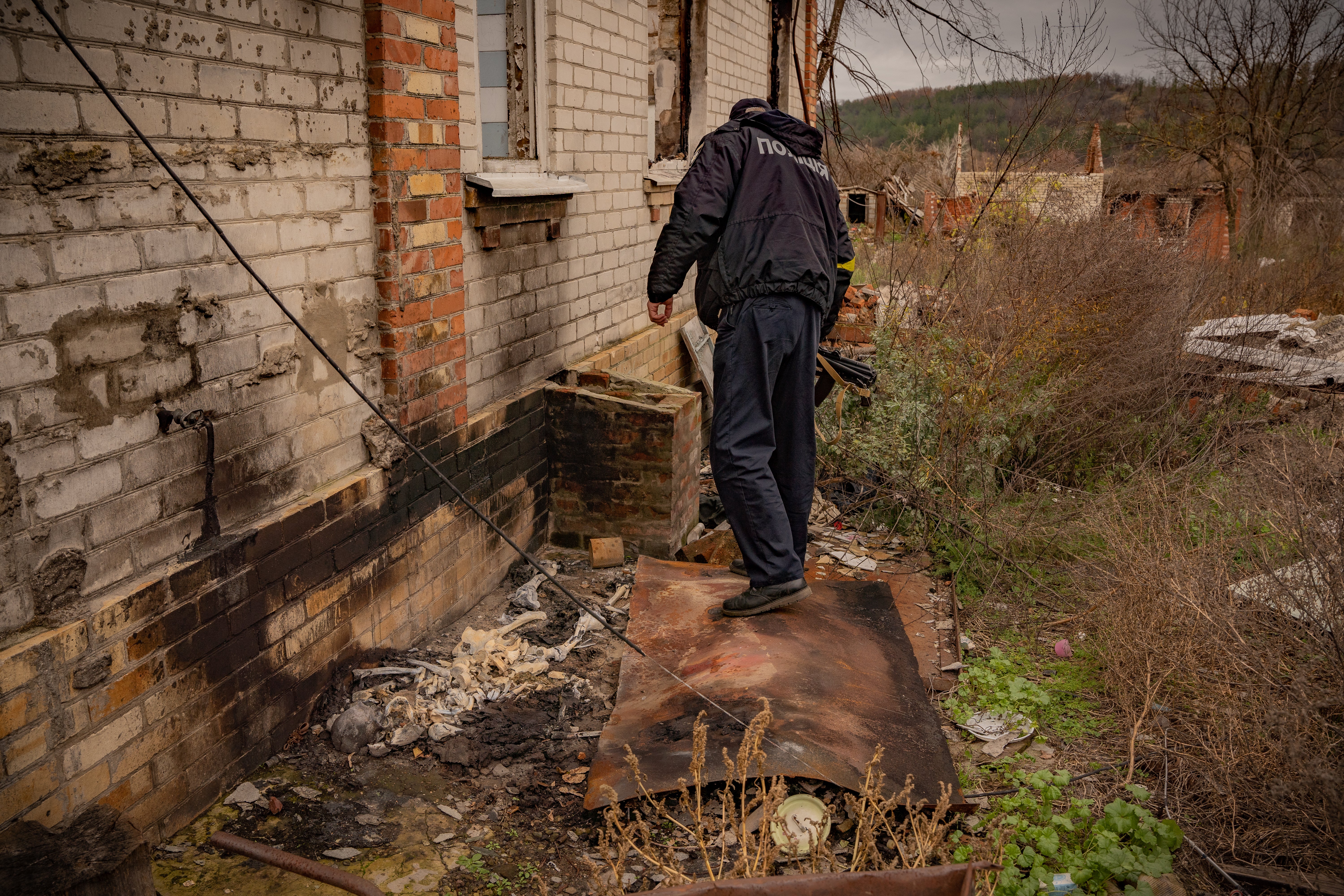 Police find the remains of another body, this time in a destroyed village outside of Izium