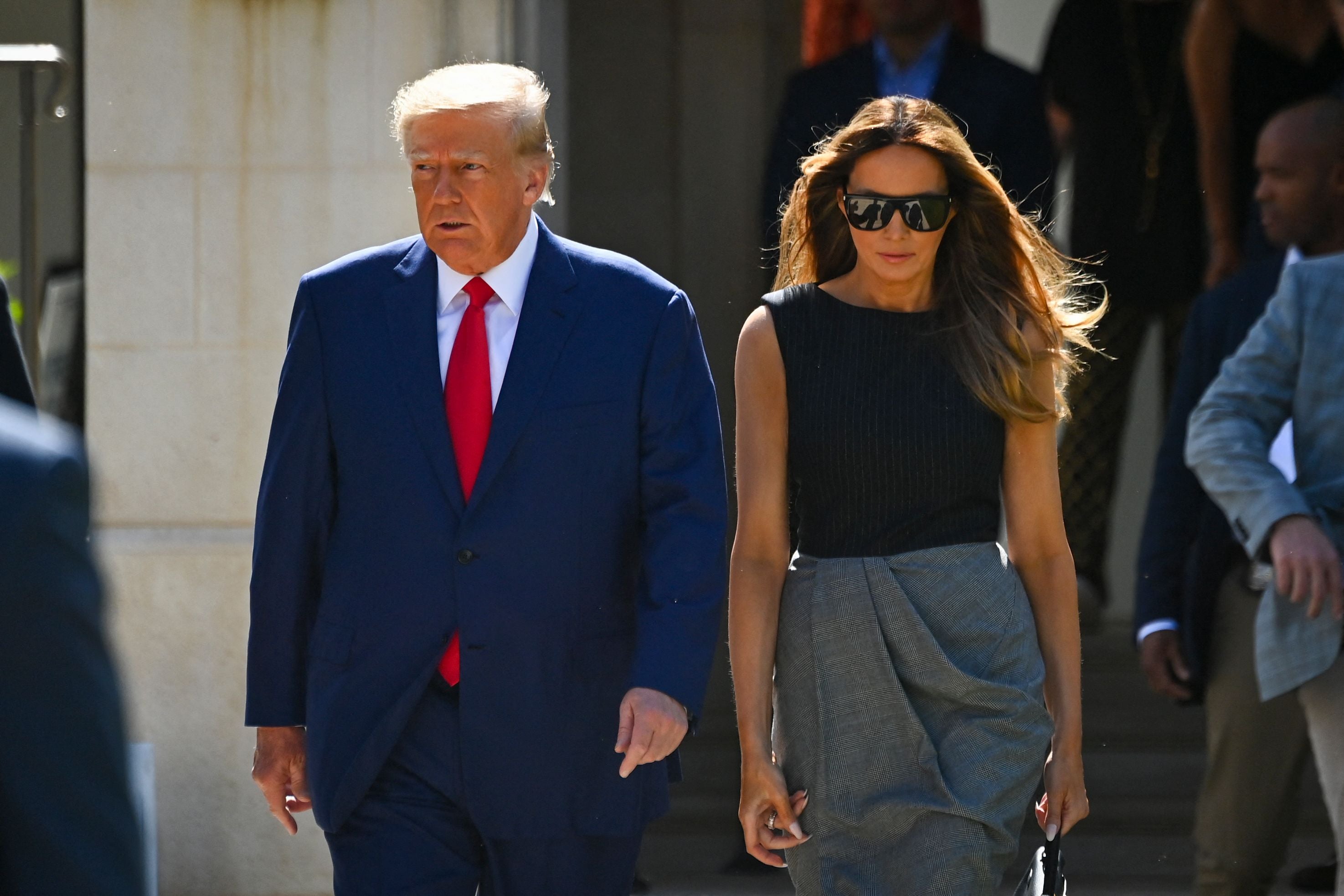 Donald and Melania Trump leave a polling station after voting in the US midterm elections in Palm Beach, Florida, on November 8, 2022