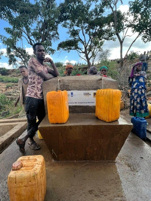 Villagers collect water from one of International Rescue Committee’s sustainable water projects in Ethiopia