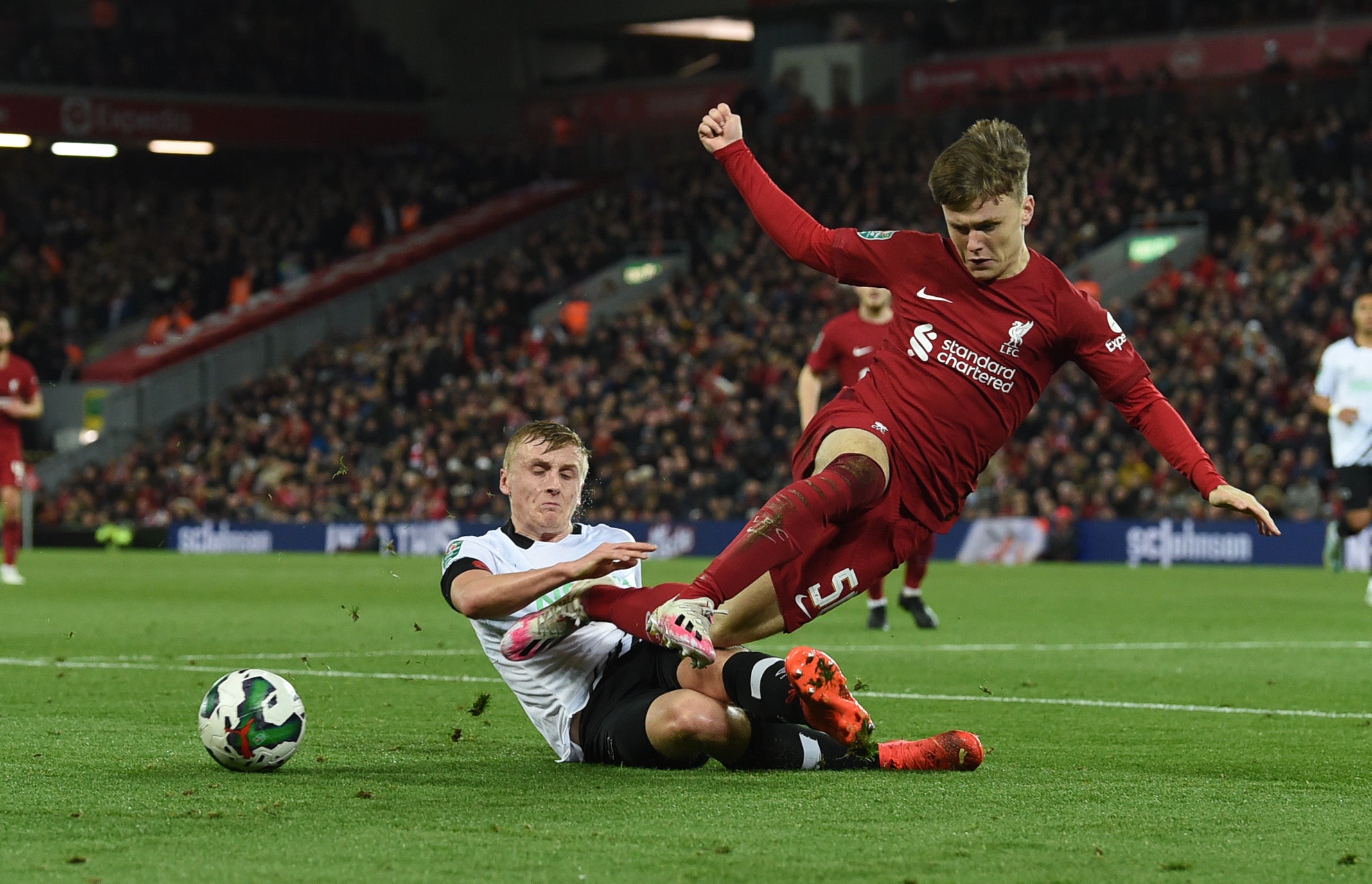 Liverpool’s Ben Doak is challenged