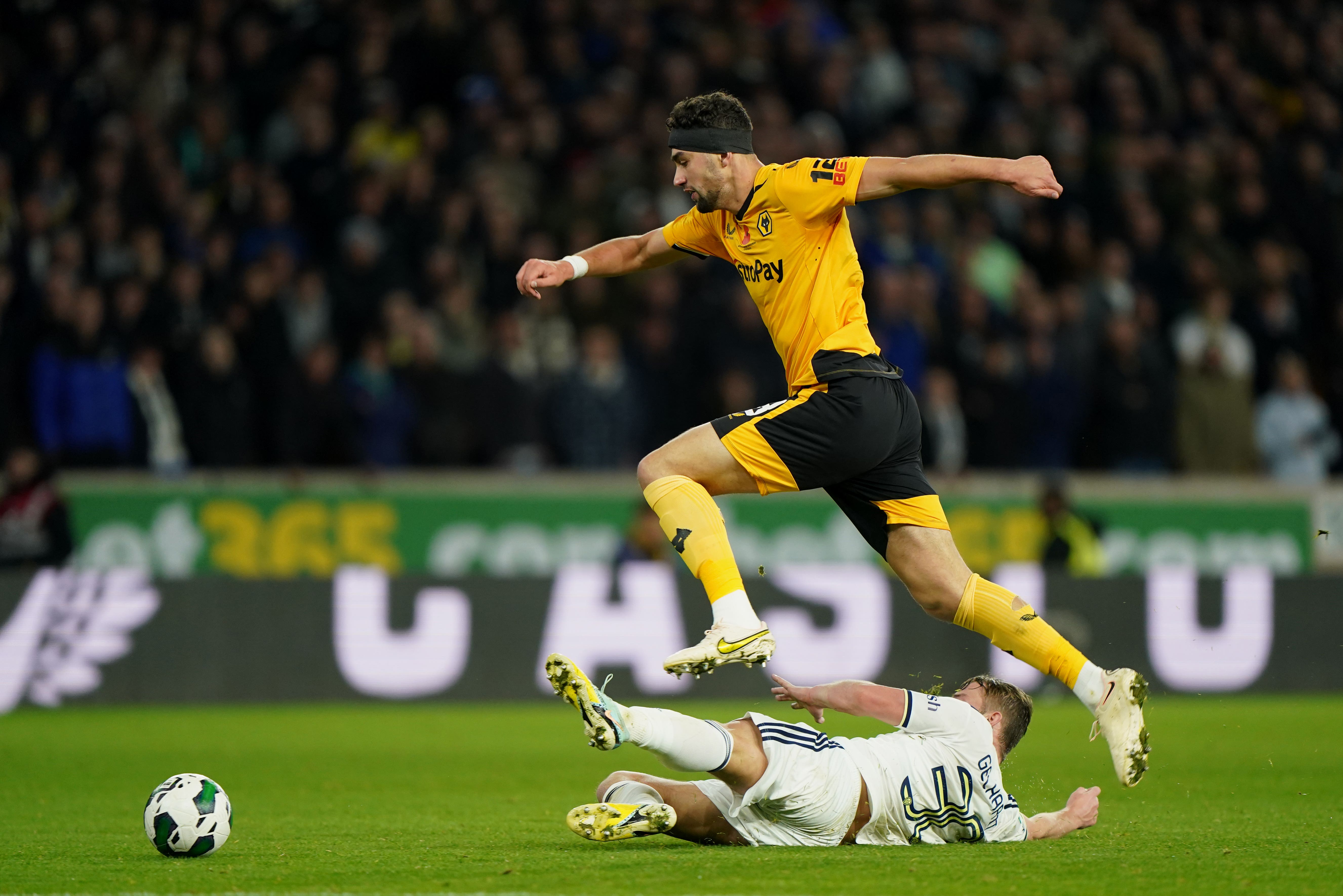 Max Kilman battles for the ball with Joe Gelhardt (Joe Giddens/PA)