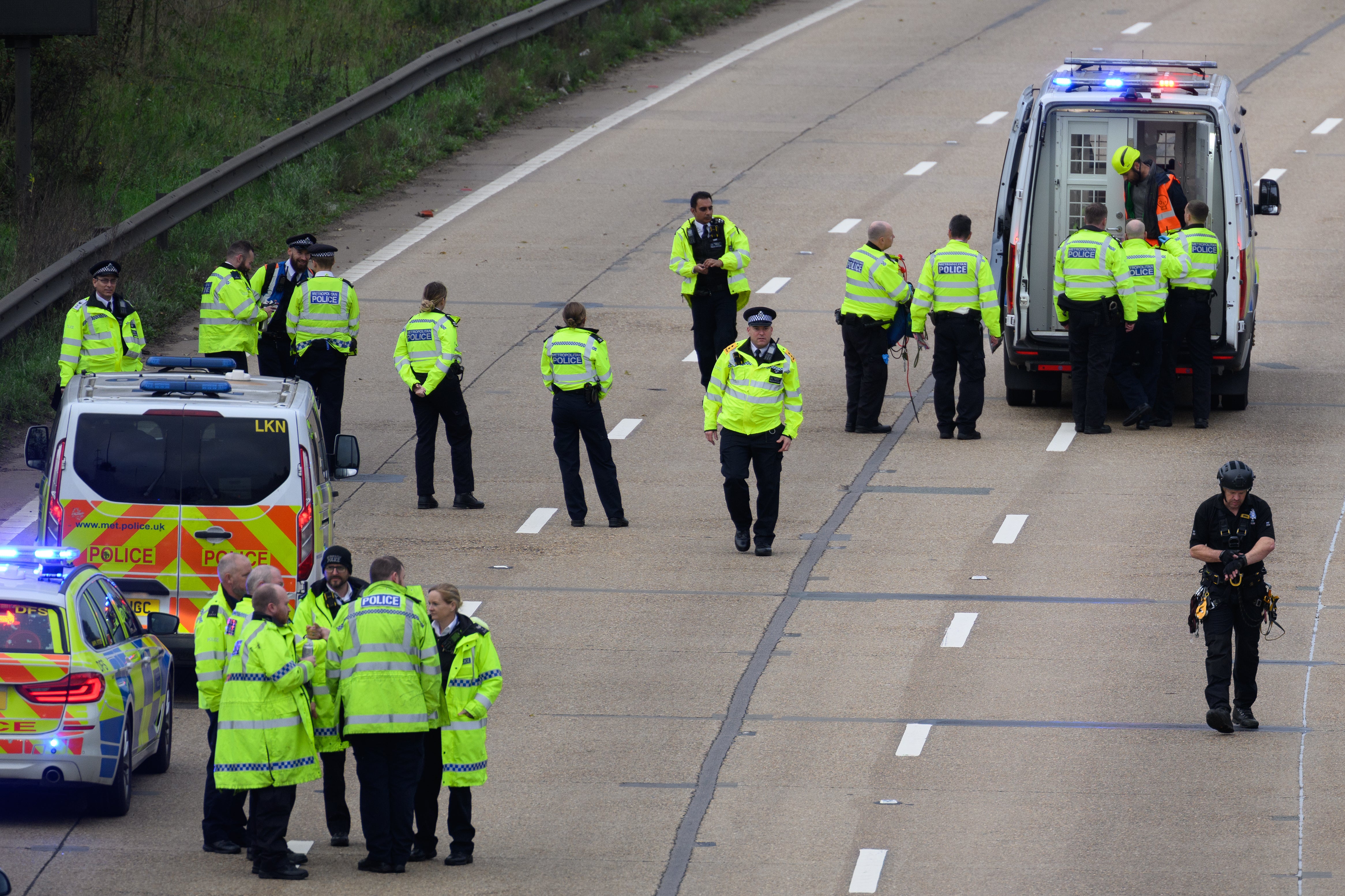 Police at the scene of one of the motorway protests this week