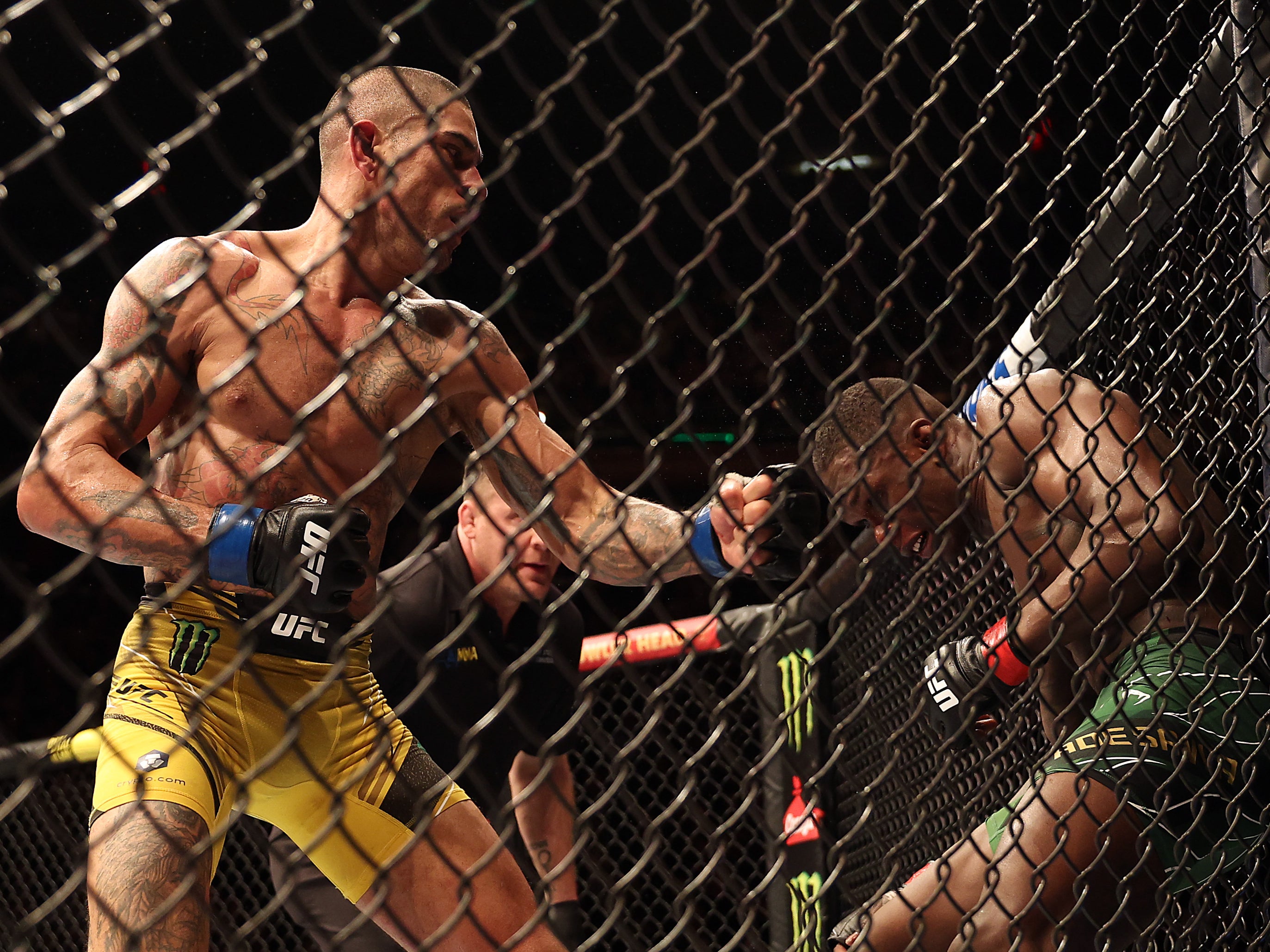 Alex Pereira (left) secured a TKO win against Israel Adesanya in November