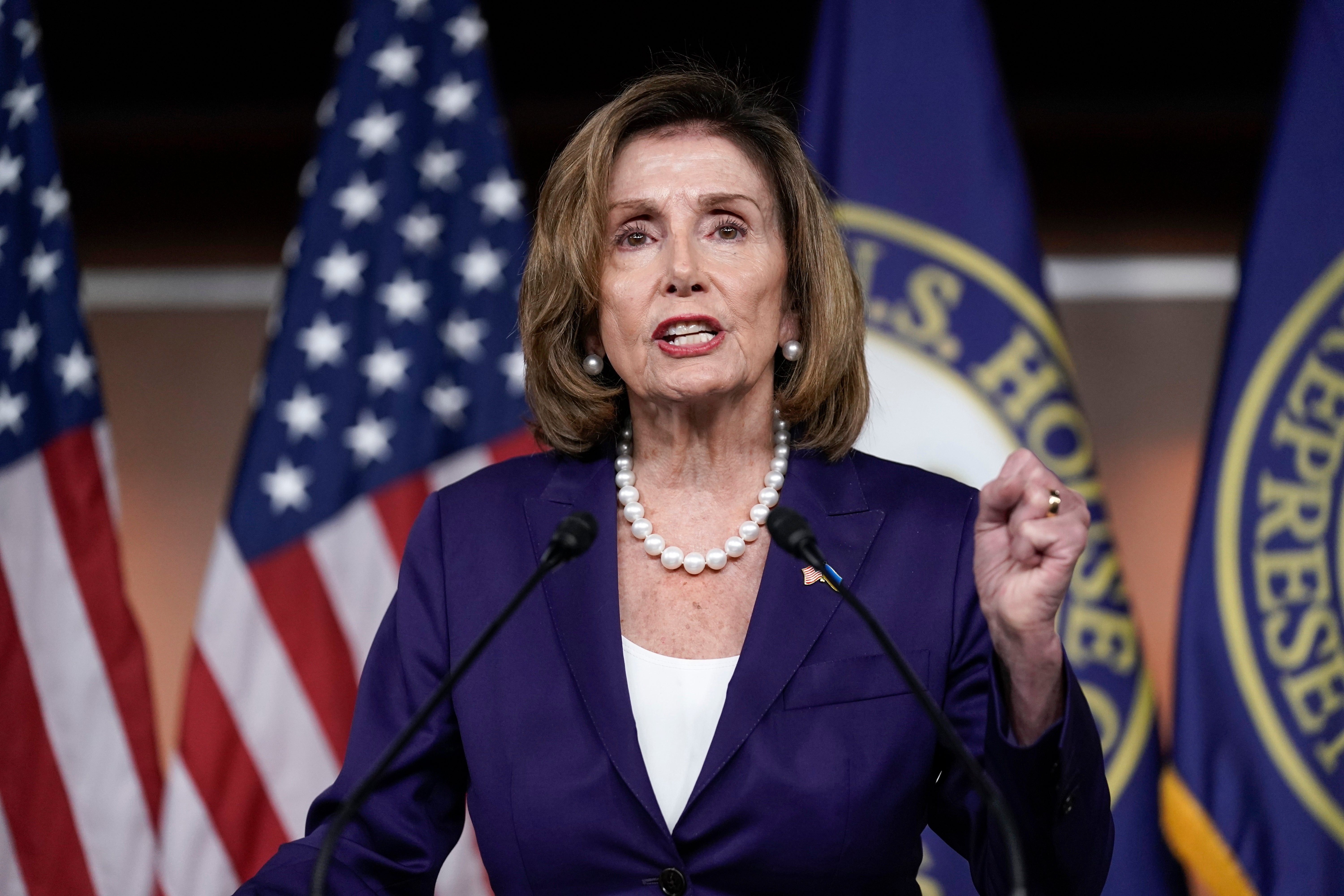 Pelosi speaks to the press after trying to introduce an assault weapons ban bill to the House