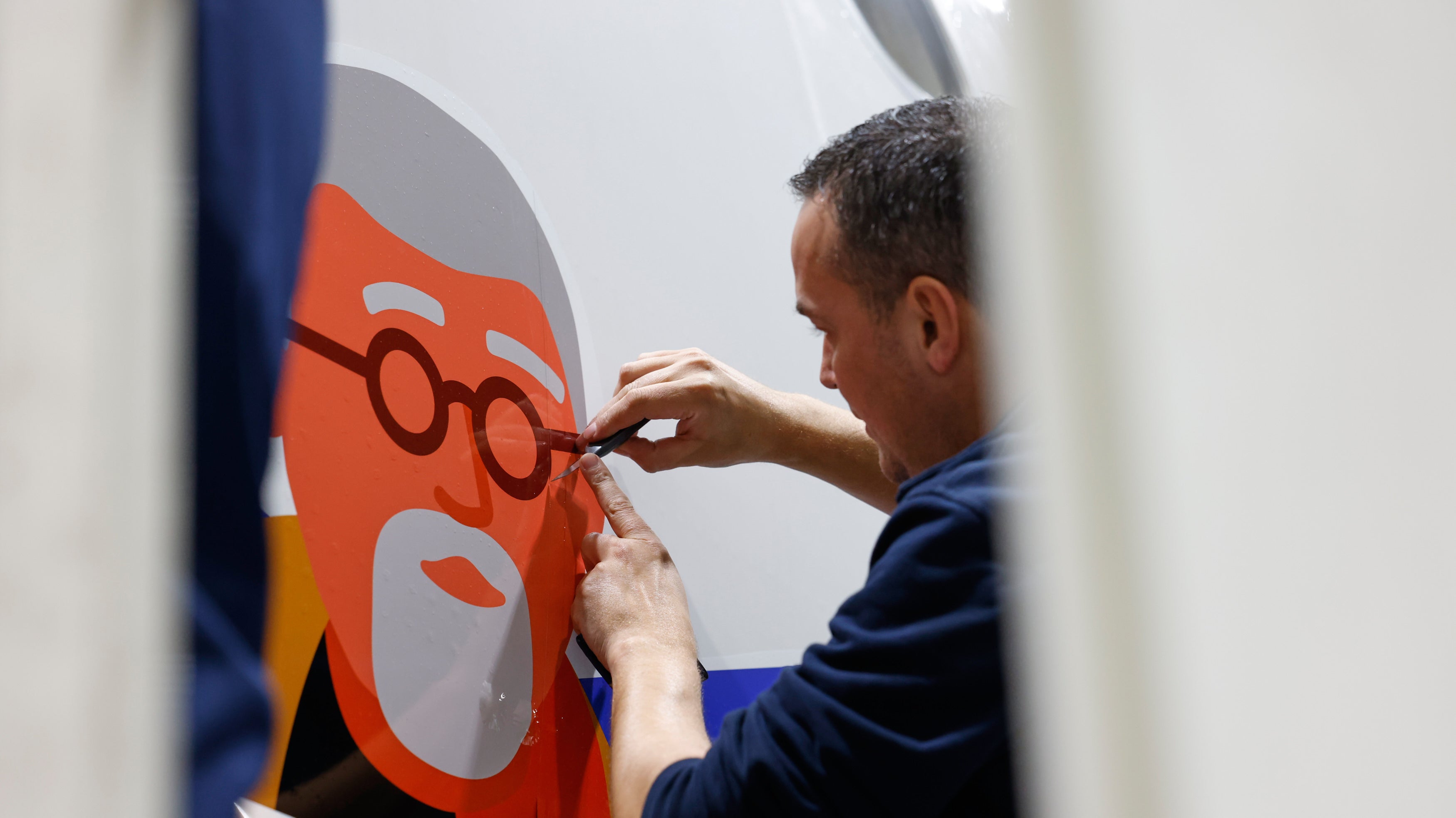 Artists putting the finishing touches to the mural