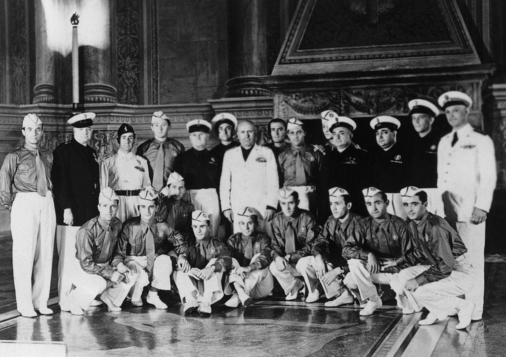 Benito Mussolini, in white, receives the Italian World Cup team. Giuseppe Meazza, the captain, stands to the right of Il Duce