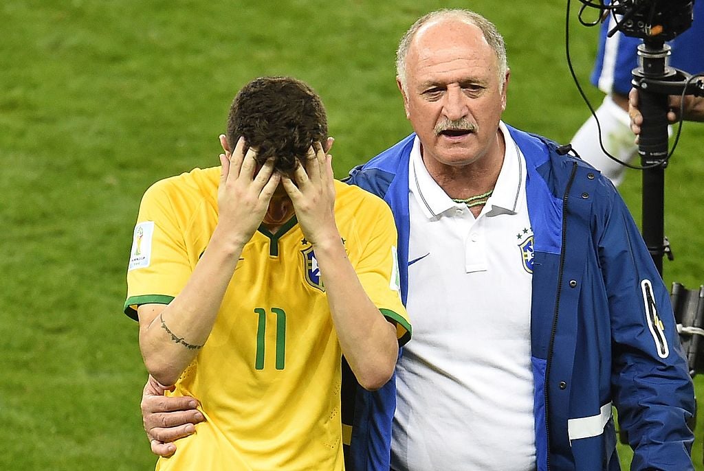 Scolari consoles Brazil’s Oscar after the 7-1 thrashing