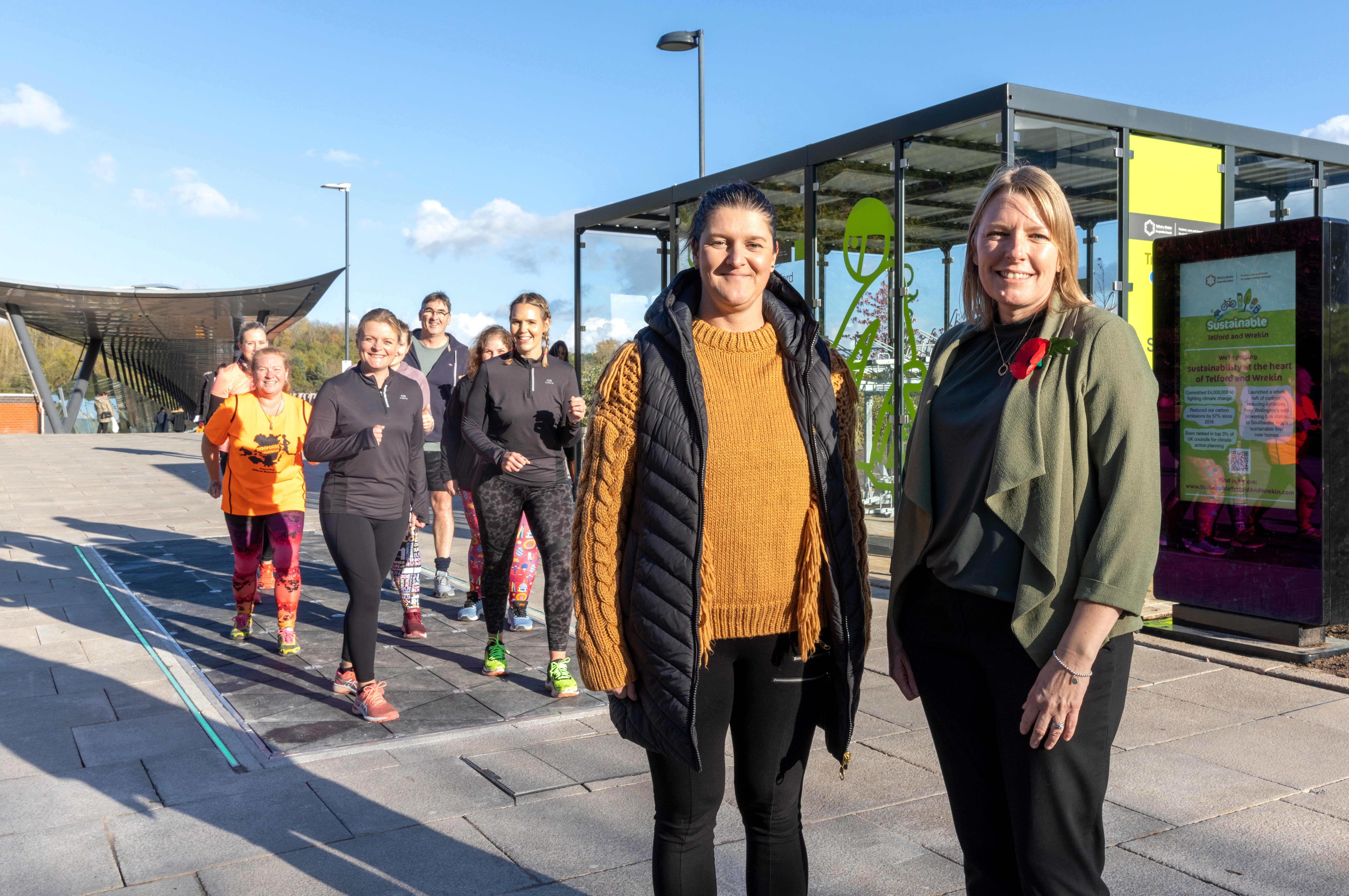 Carolyn Healy (R) with project officer Nikki Heath as walkers demonstrate the pavement’s function