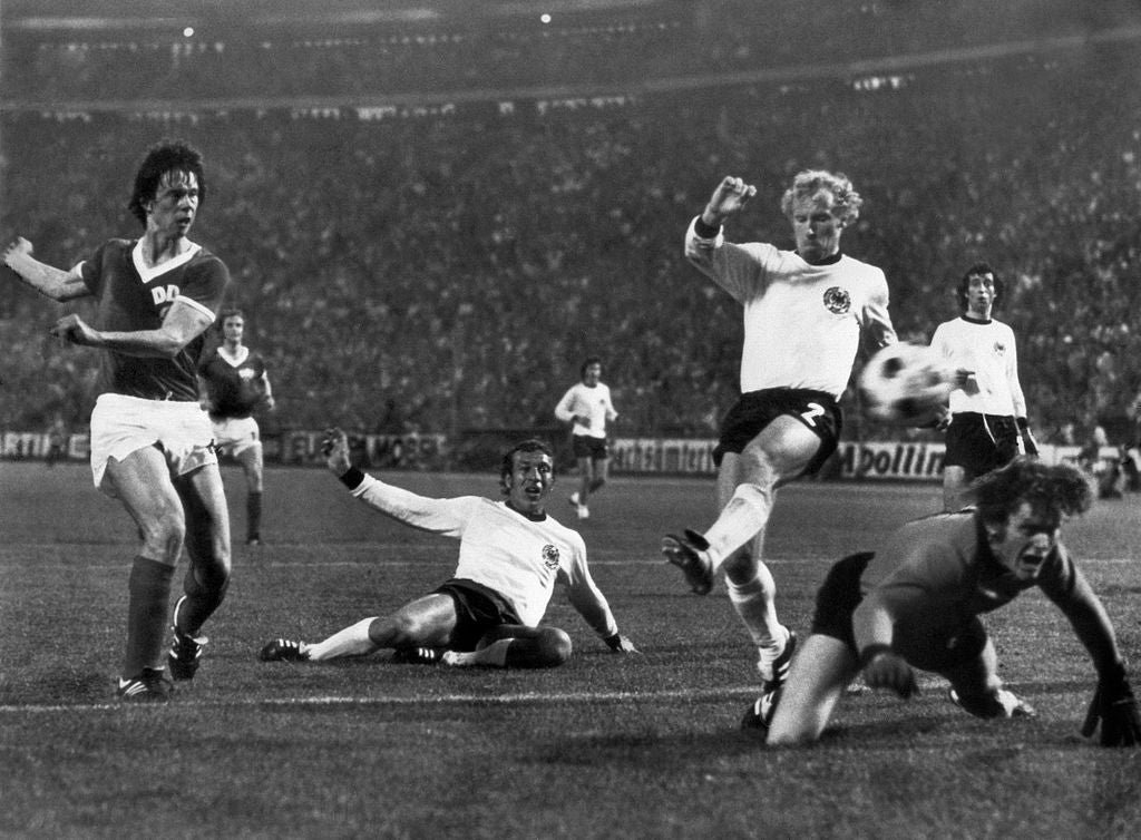 East Germany forward Jürgen Sparwasser evades Horst-Dieter Höttges and Berti Vogts to score the winning goal