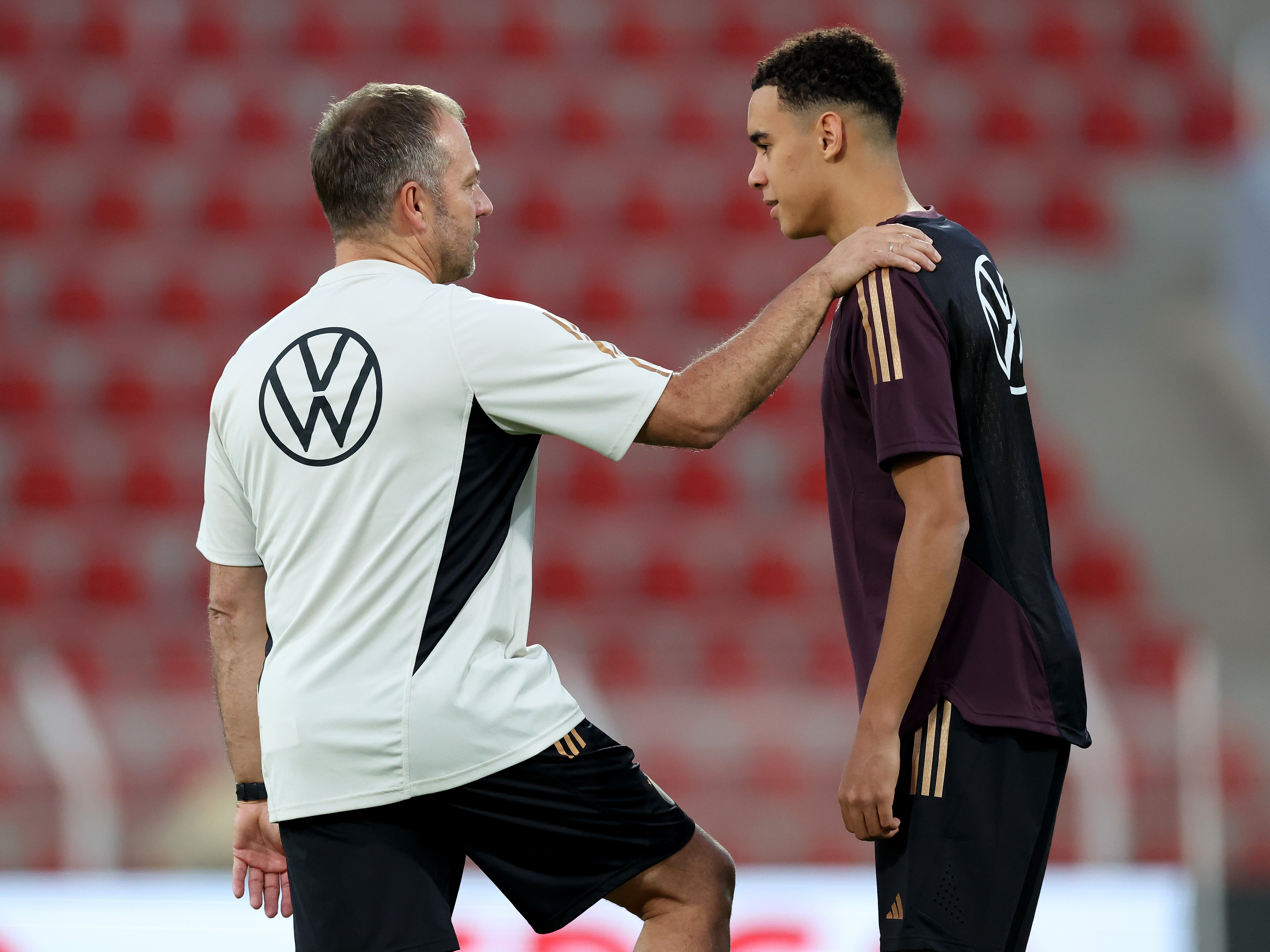 Germany coach Hansi Flick with Jamal Musiala