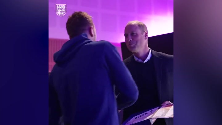 Prince William presents each England player their World Cup shirt