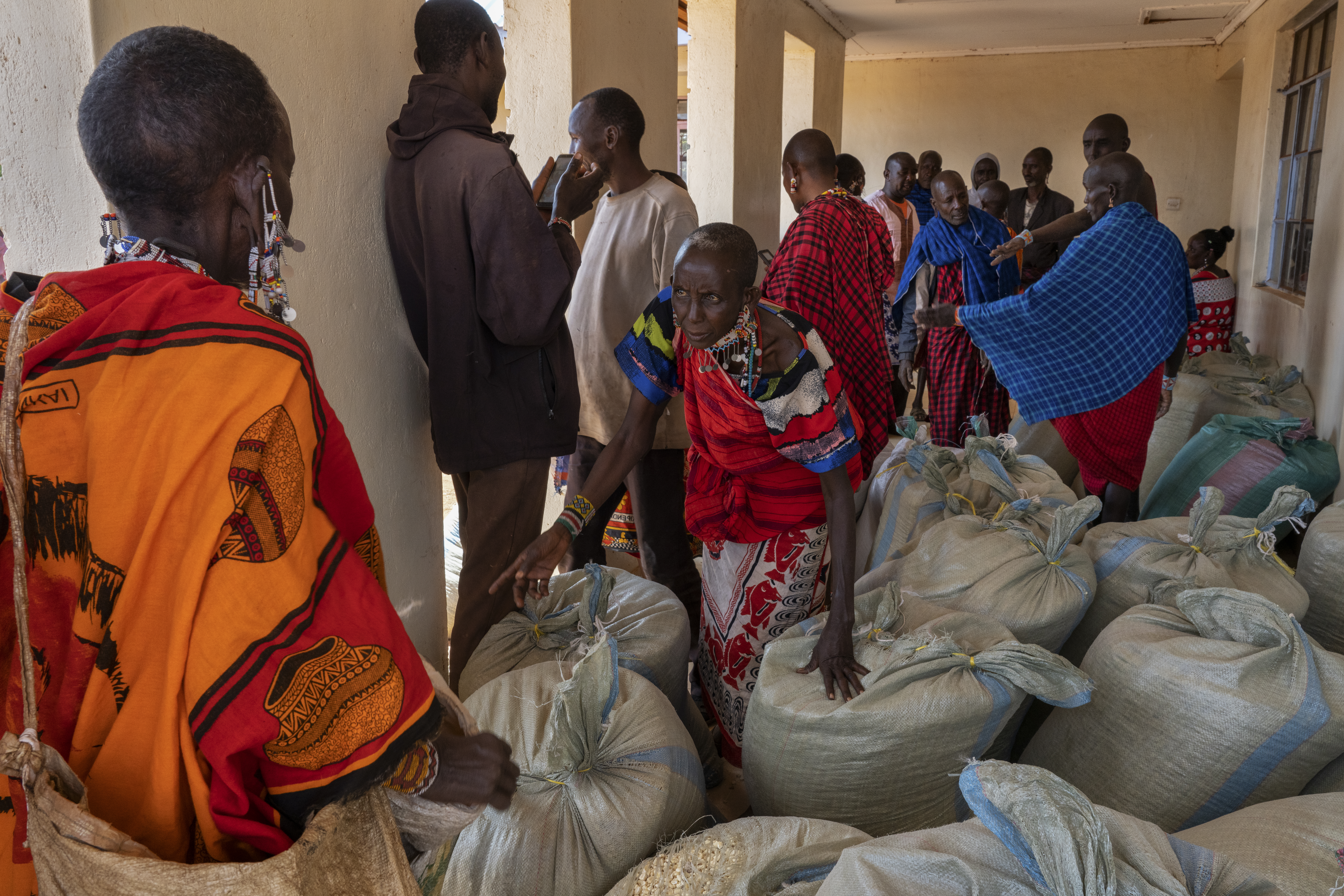 Two Maasai communties negotioate over a delivery of maize from a local tourist lodge. With their cattle dying and no crops, communities are suffering across southern Kenya