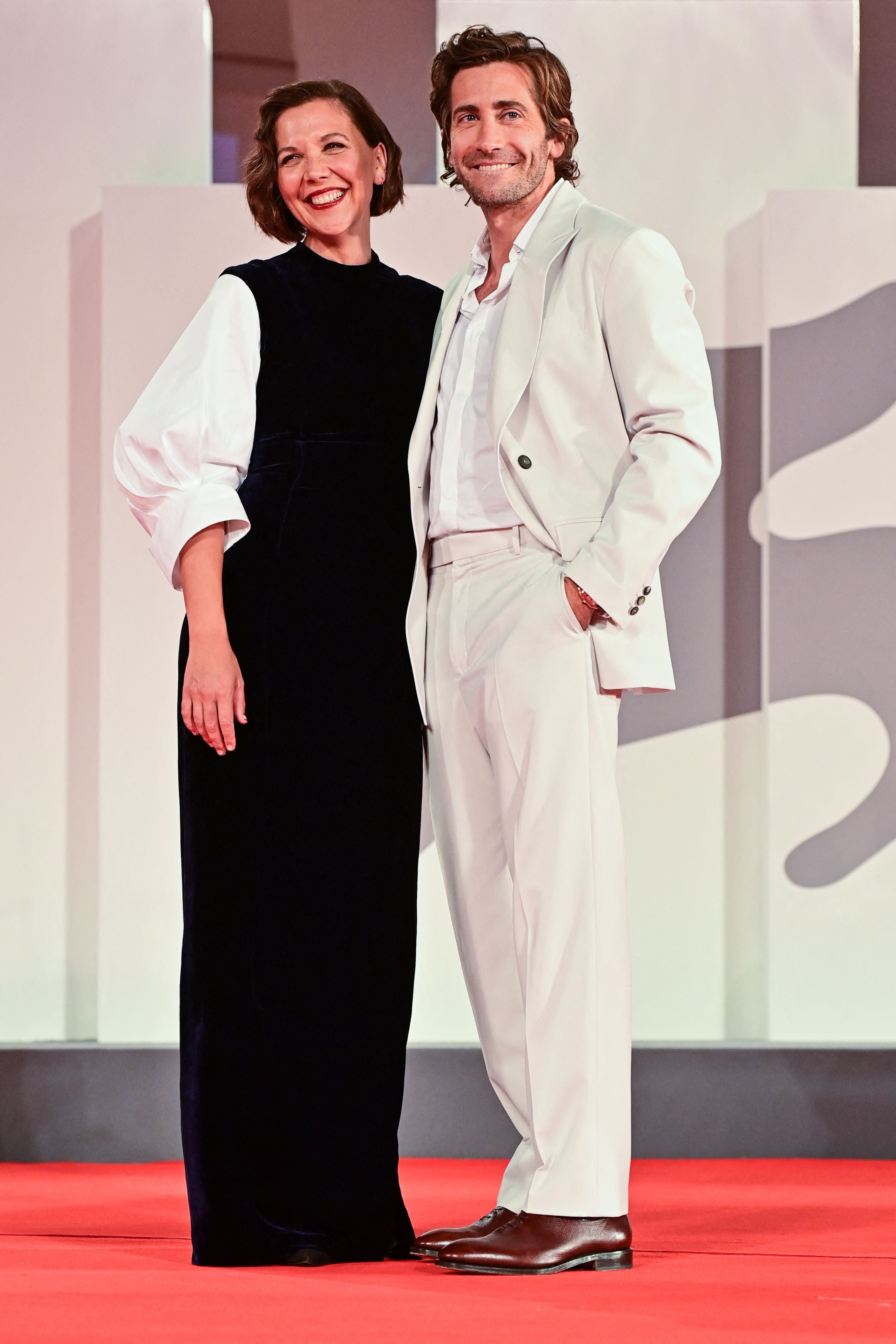 Maggie Gyllenhaal and her brother Jake Gyllenhaal arrive for the screening of the film “The Lost Daughter” presented in competition on September 3, 2021