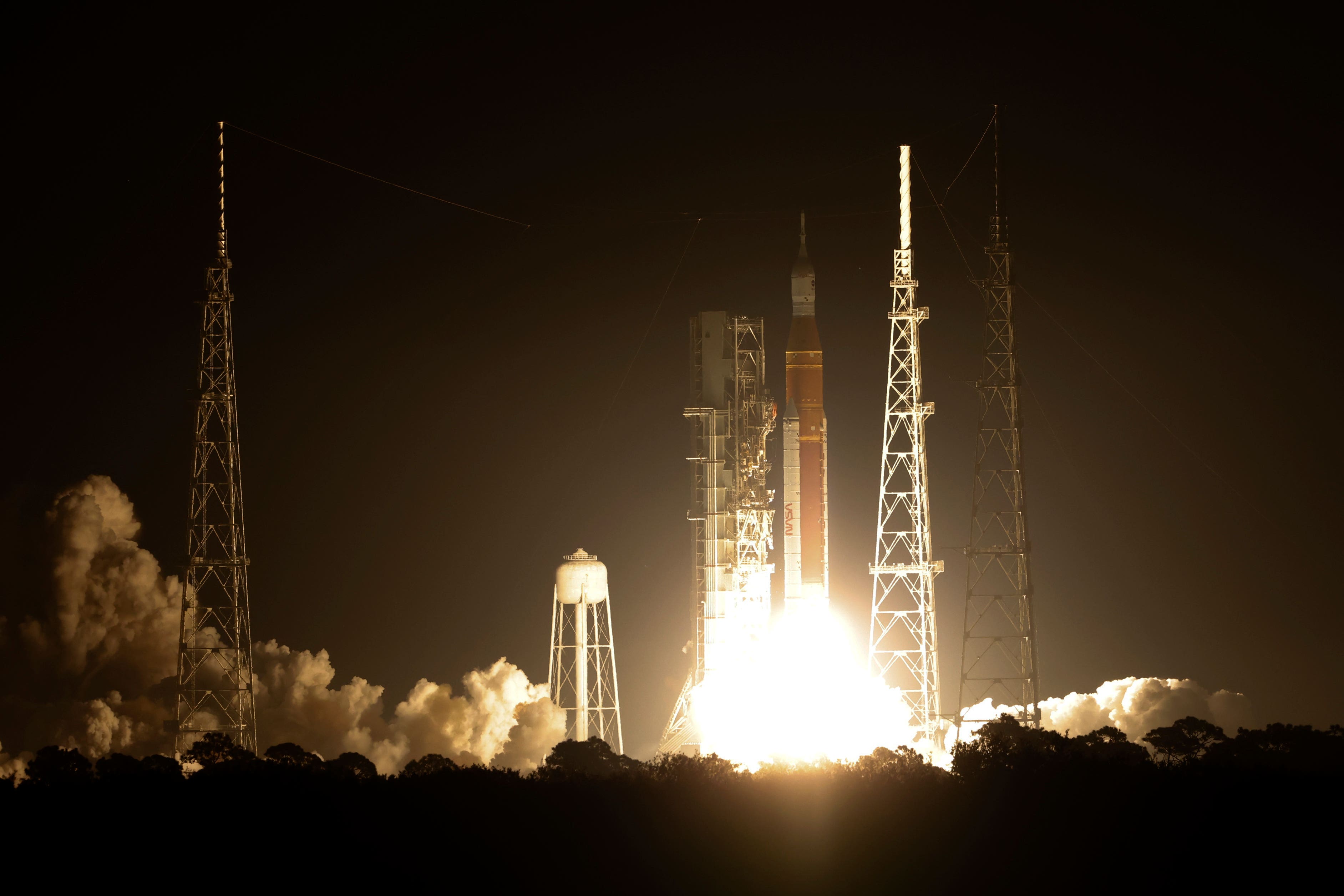 Nasa’s new moon rocket lifts off from Launch Pad 39B at the Kennedy Space Centre (Terry Renna/AP)