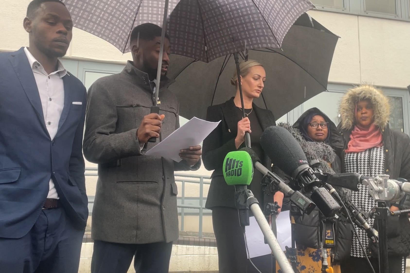 Awaab Ishak’s mother and father give a statement outside Rochdale Coroner’s Court following the conclusion of an inquest into their son’s death (Eleanor Barlow/PA)