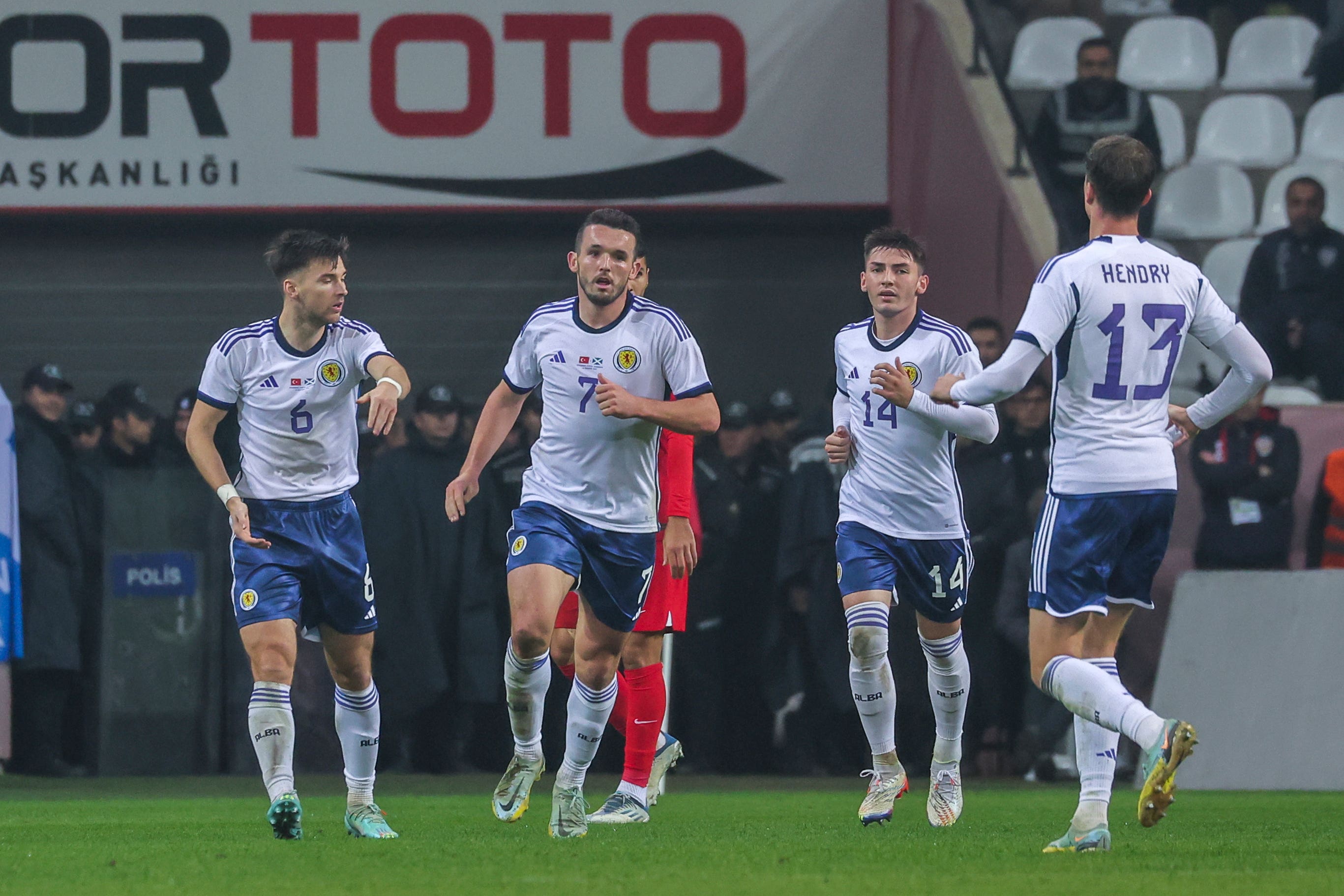 John McGinn, centre, struck for Scotland (AP)