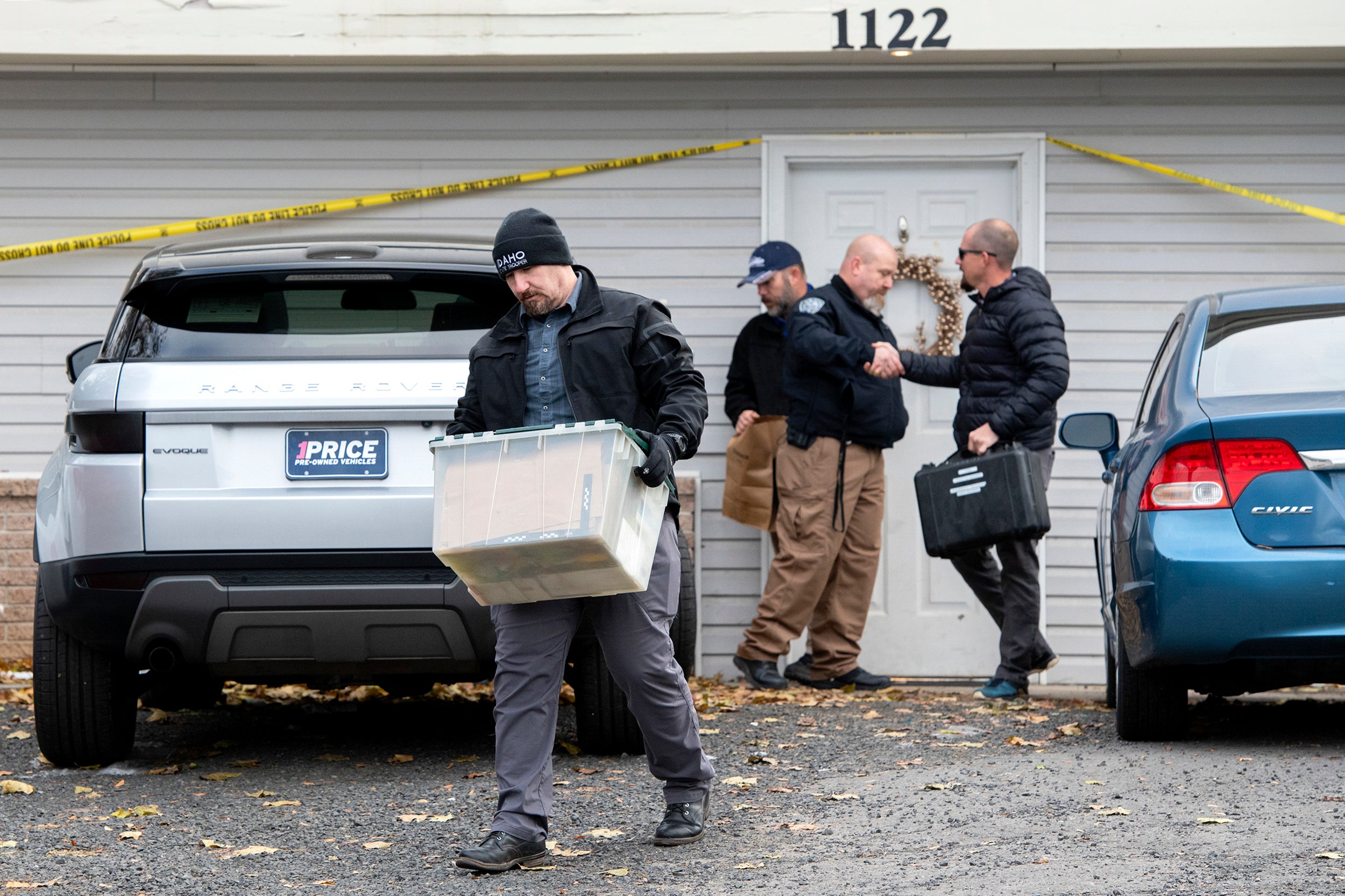 Officers remove evidence from the home where four University of Idaho students were killed