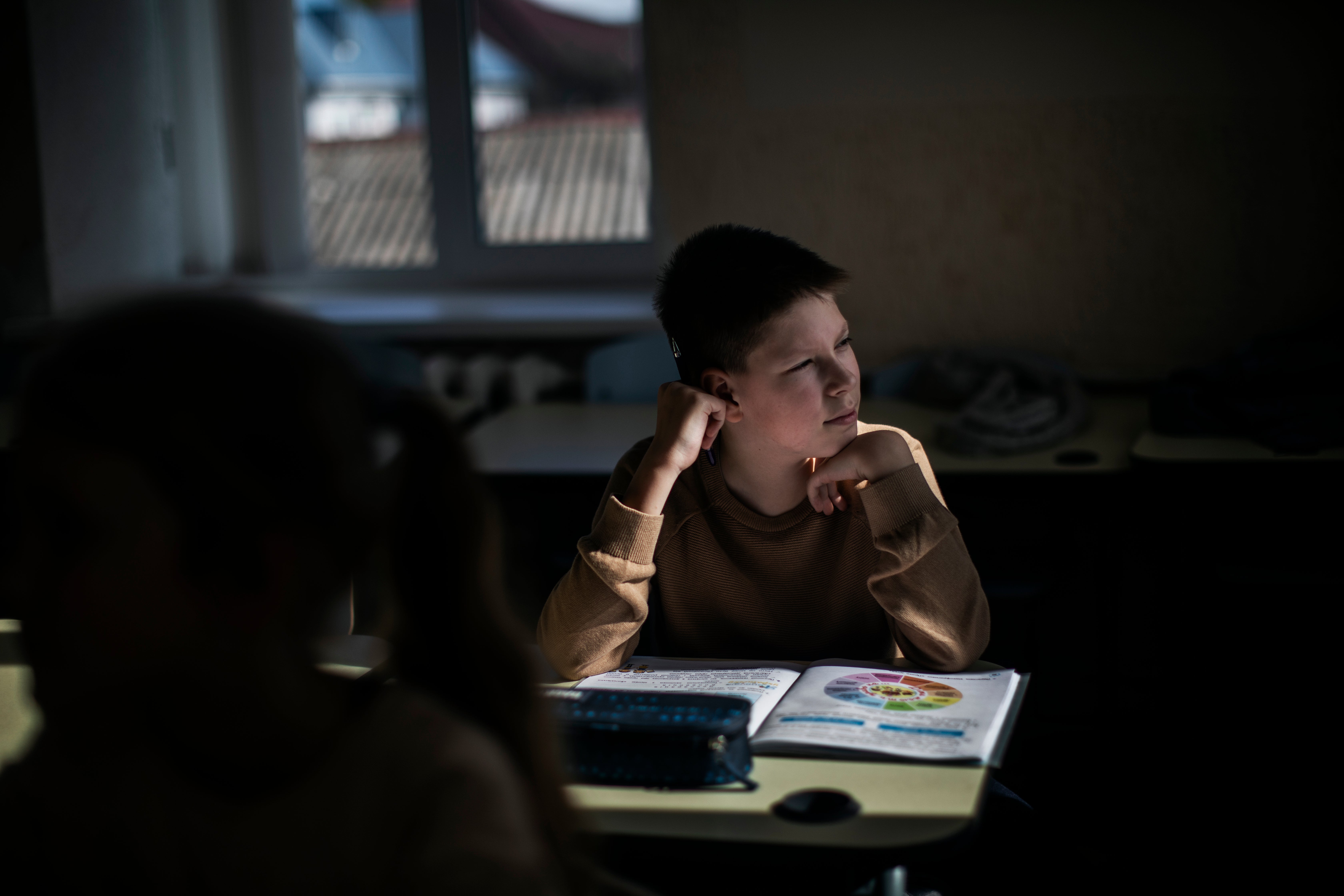 Sviatoslav, 10, sits in a renovated classroom in Zhytomyr