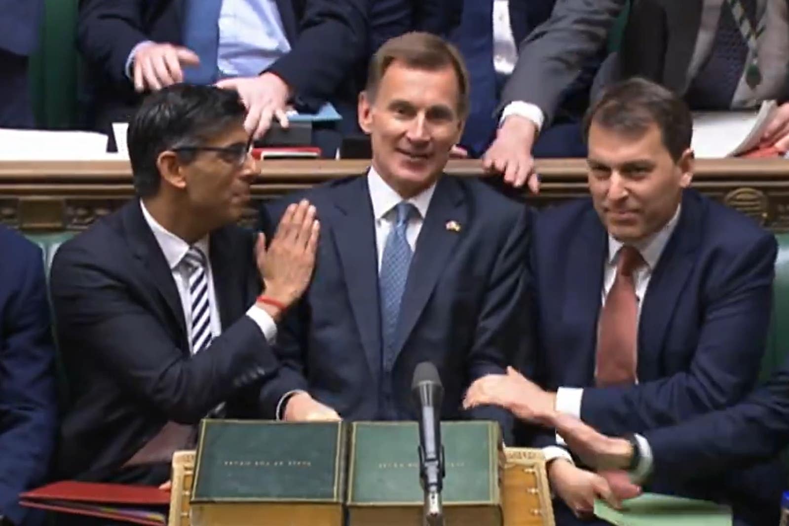 Prime Minister Rishi Sunak congratulates Chancellor of the Exchequer Jeremy Hunt after he delivered his autumn statement to MPs in the House of Commons, London (House of Commons/PA)