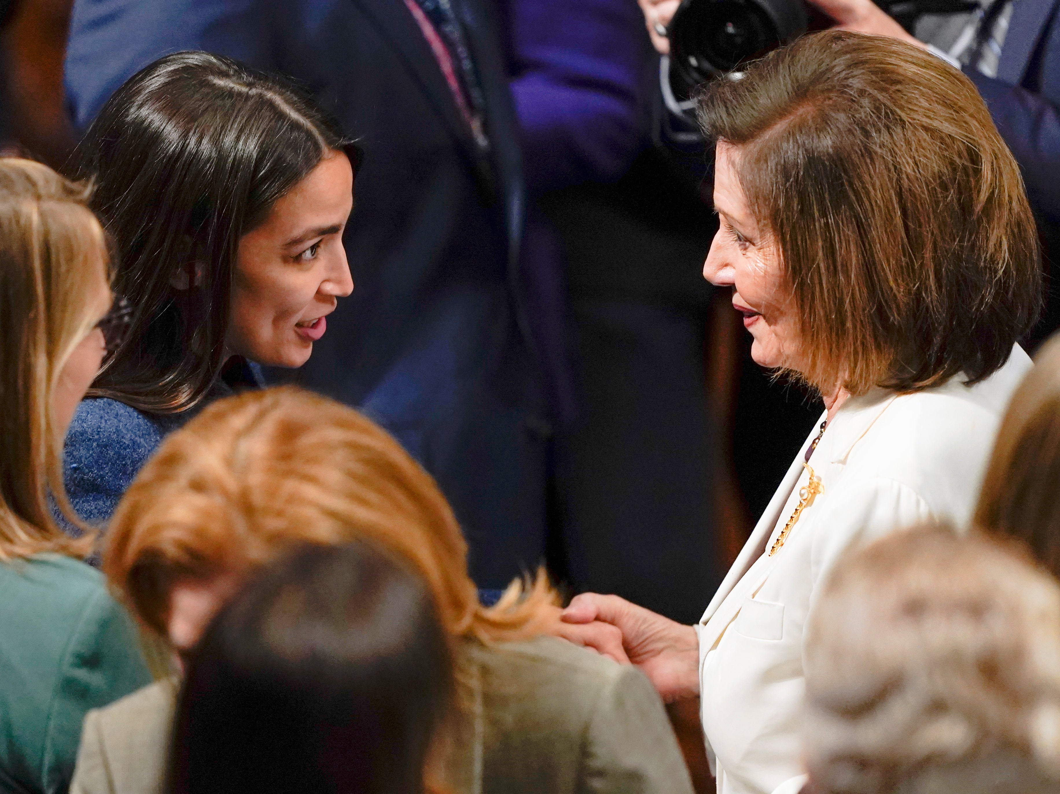 House Speaker Nancy Pelosi of Calif., talks with Rep. Alexandria Ocasio-Cortez, D-N.Y., after Pelosi spoke on the House floor at the Capitol in Washington Thursday, Nov. 17, 2022