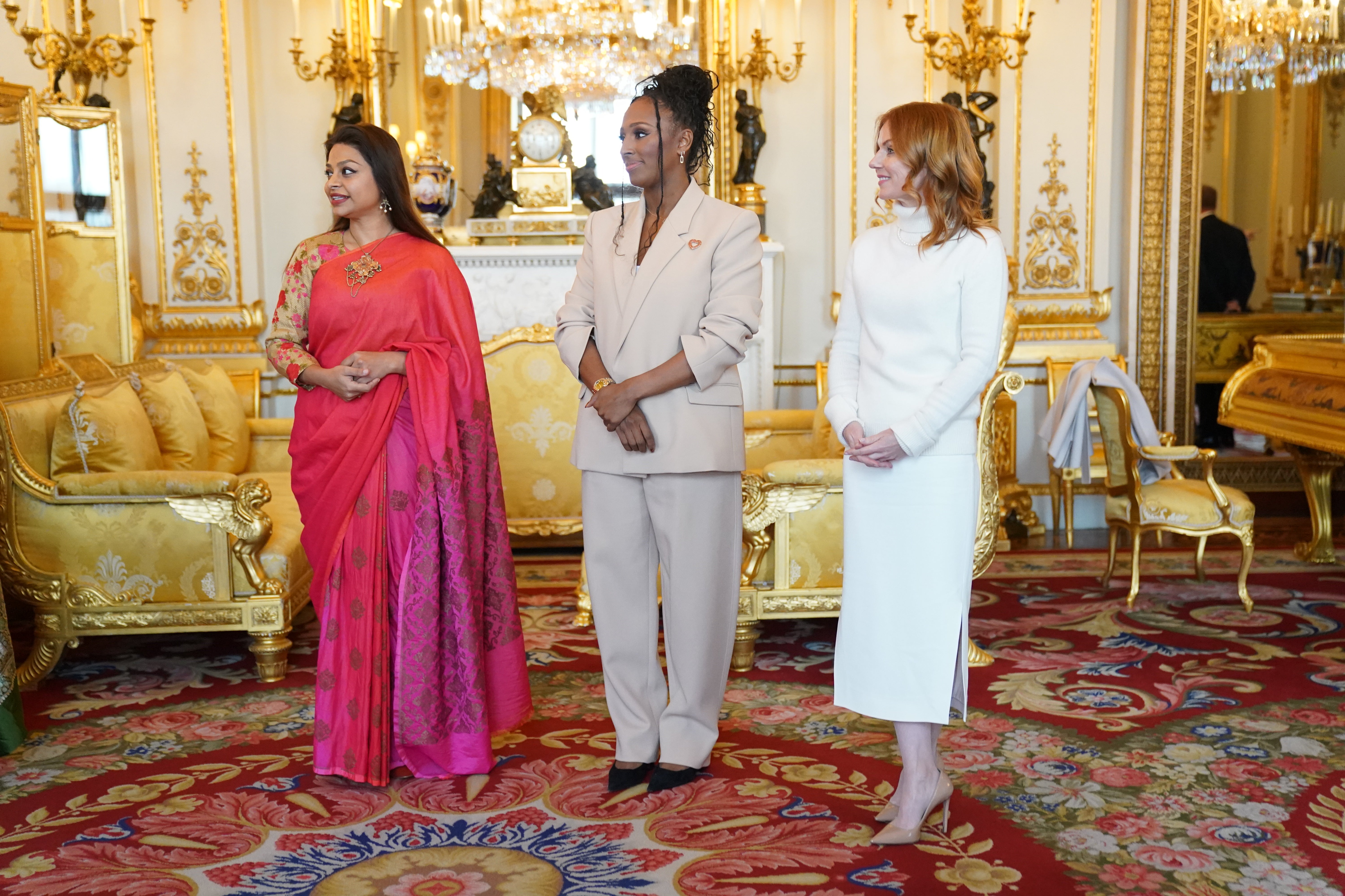 Ayesha Dharker, Alexandra Burke and Geri Horner during a reception for winners of the Queen’s Commonwealth Essay Competition, at Buckingham Palace on 17 November 2022