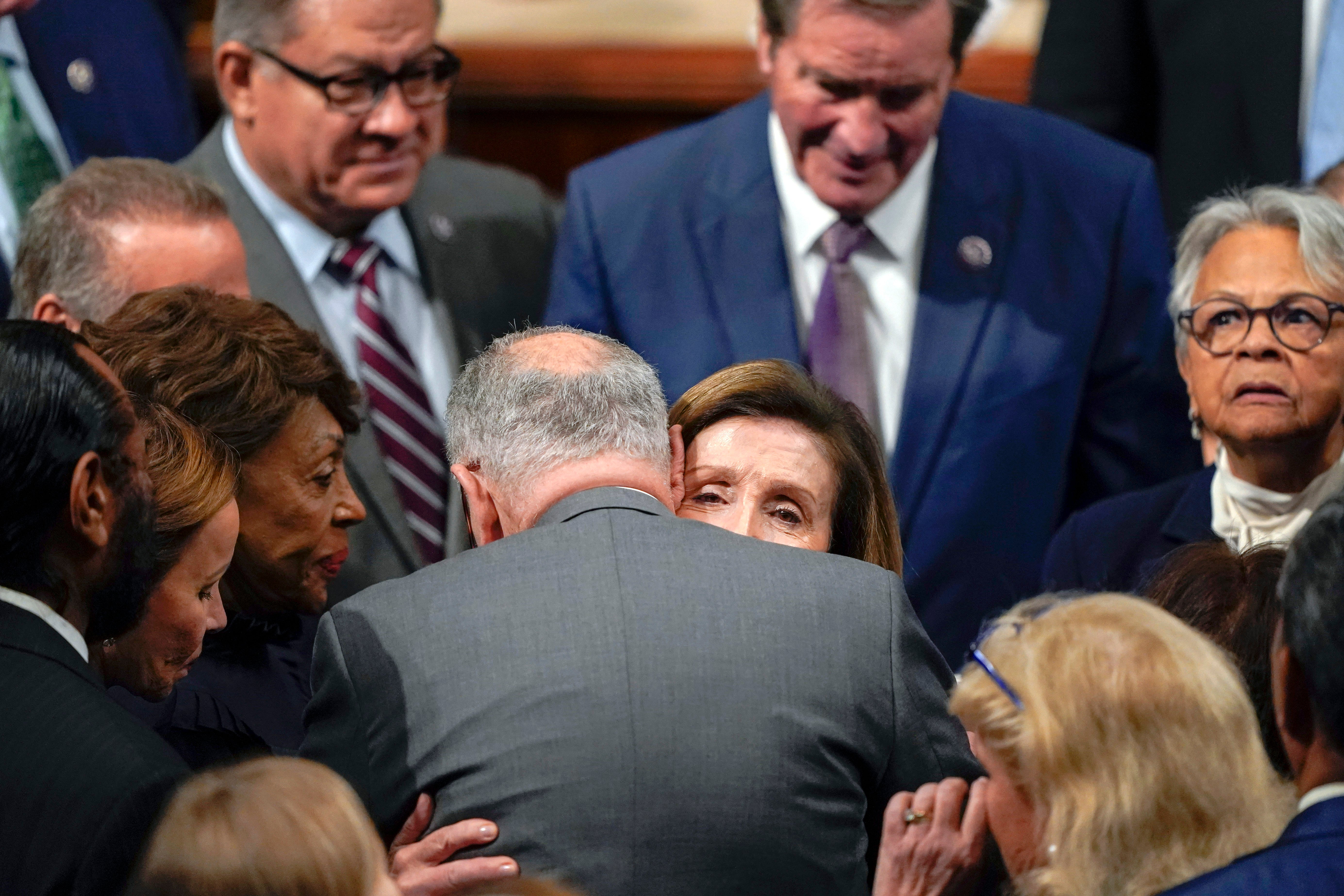 Nancy Pelosi and Chuck Schumer hug after she delivered her speech announcing she was standing down as leader of the house