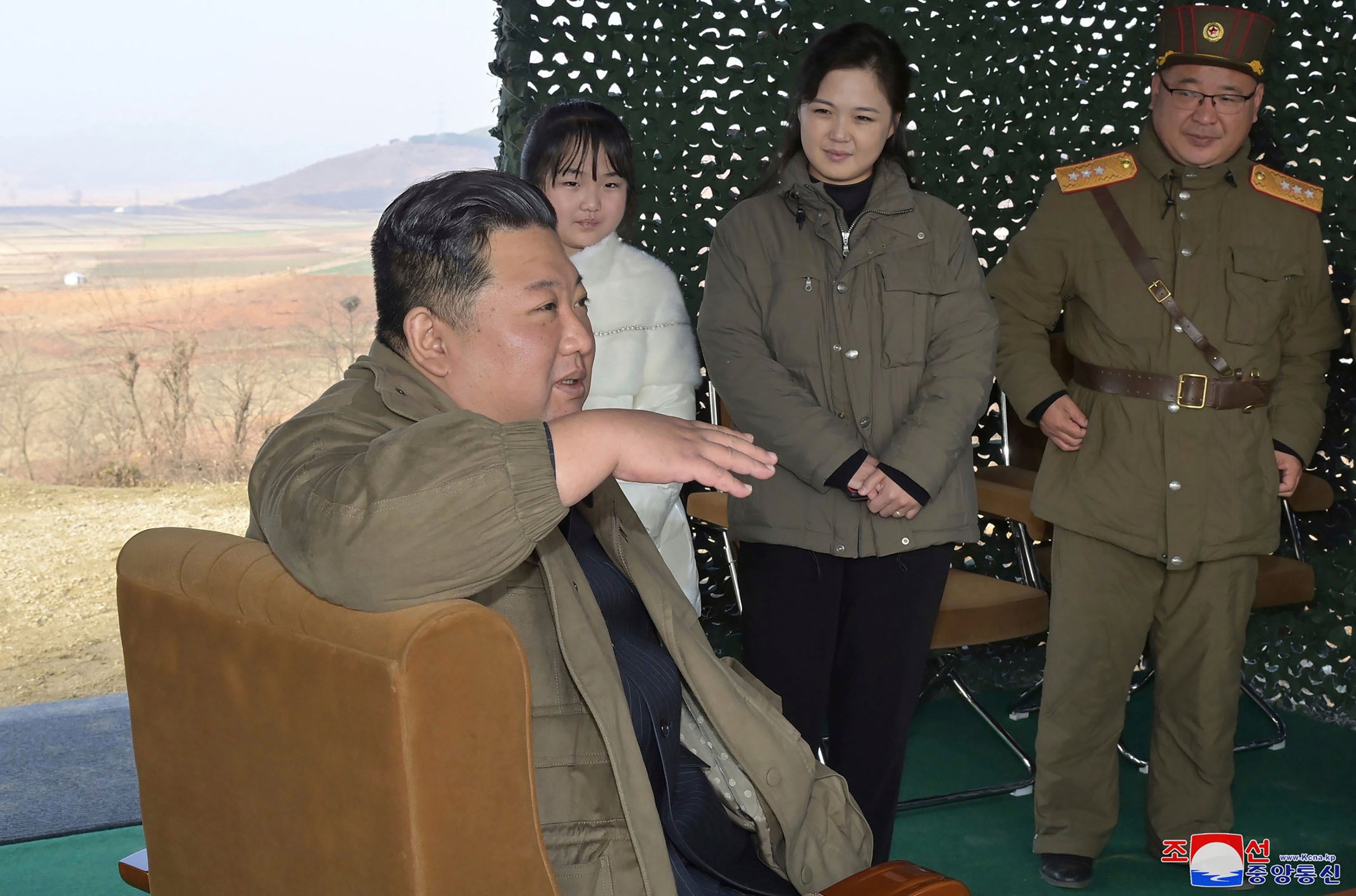 Kim Jong-un, speaks, accompanied by his wife Ri Sol Ju, second from right, and his daughter