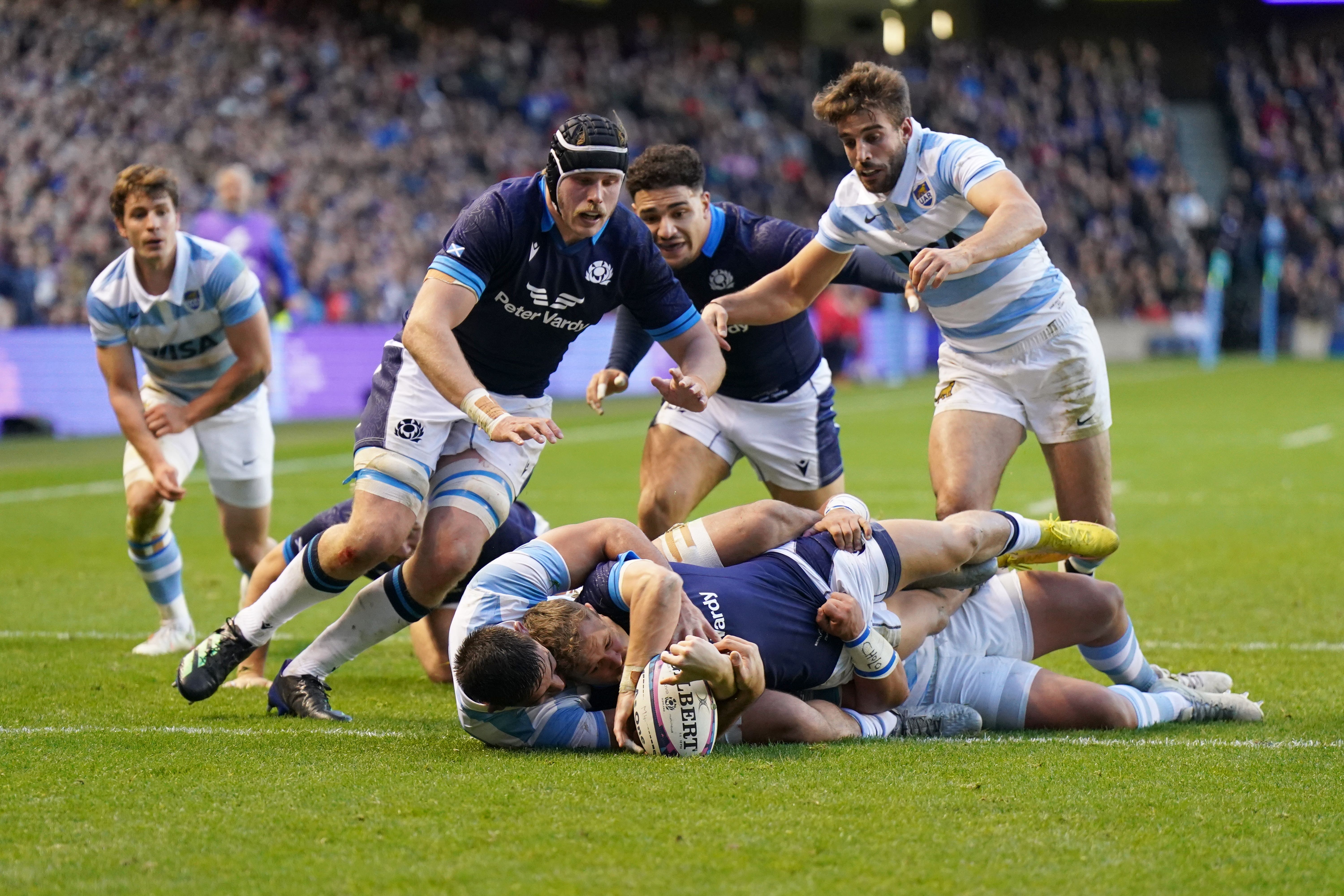 Darcy Graham (centre-bottom) scored Scotland’s third try (Jane Barlow/PA)