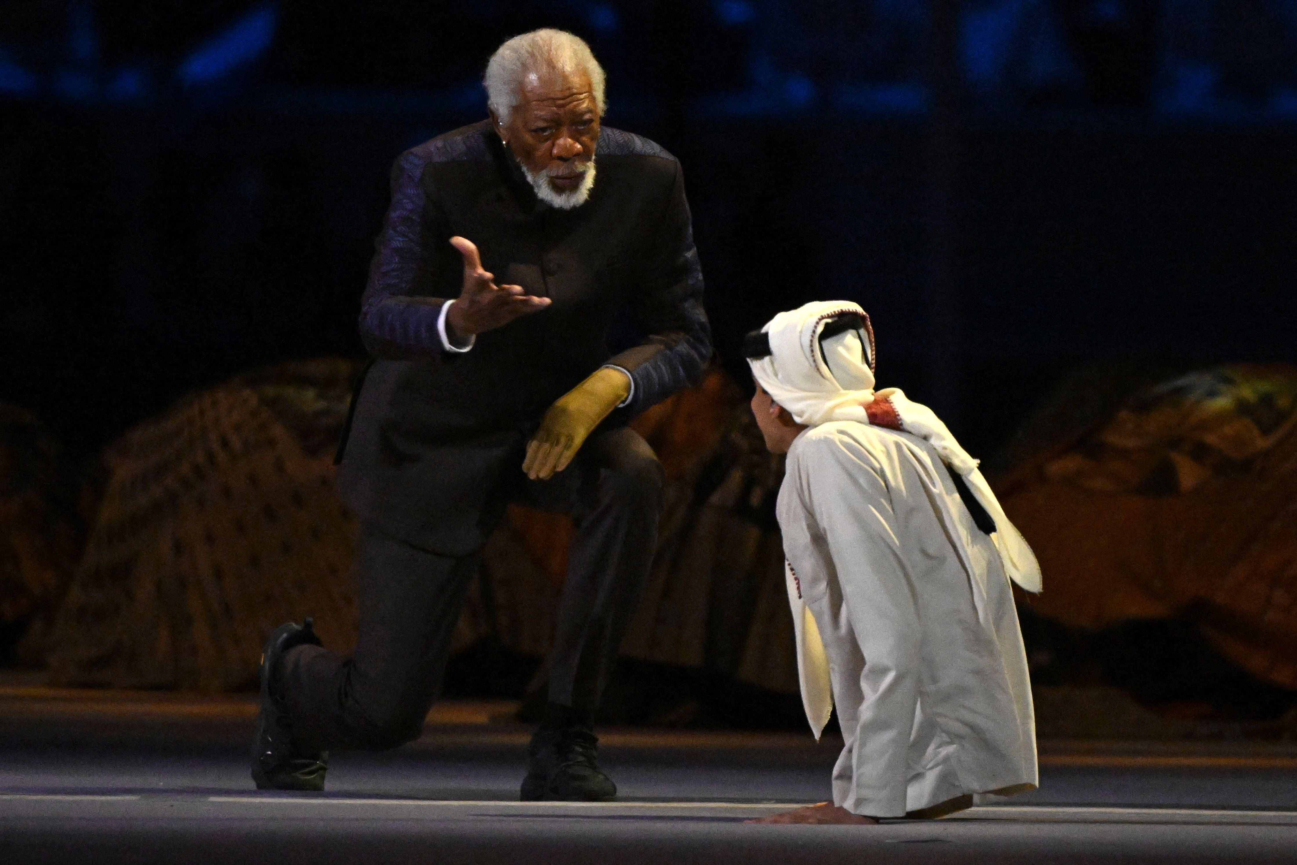 US actor Morgan Freeman (L) and Qatari YouTuber Ghanim al-Muftah speak during the opening ceremony