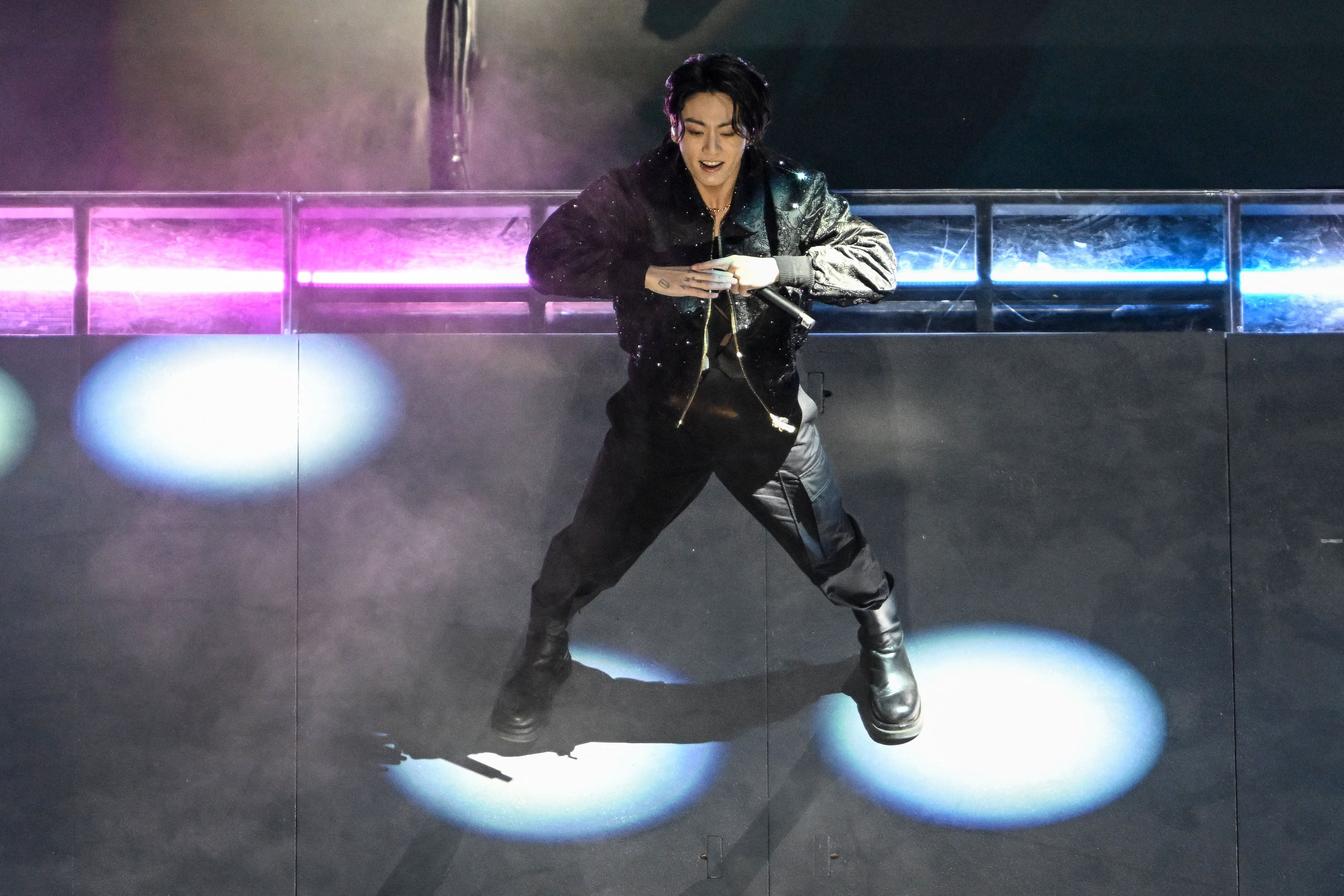 South Korean singer Jung Kook performs during the opening ceremony