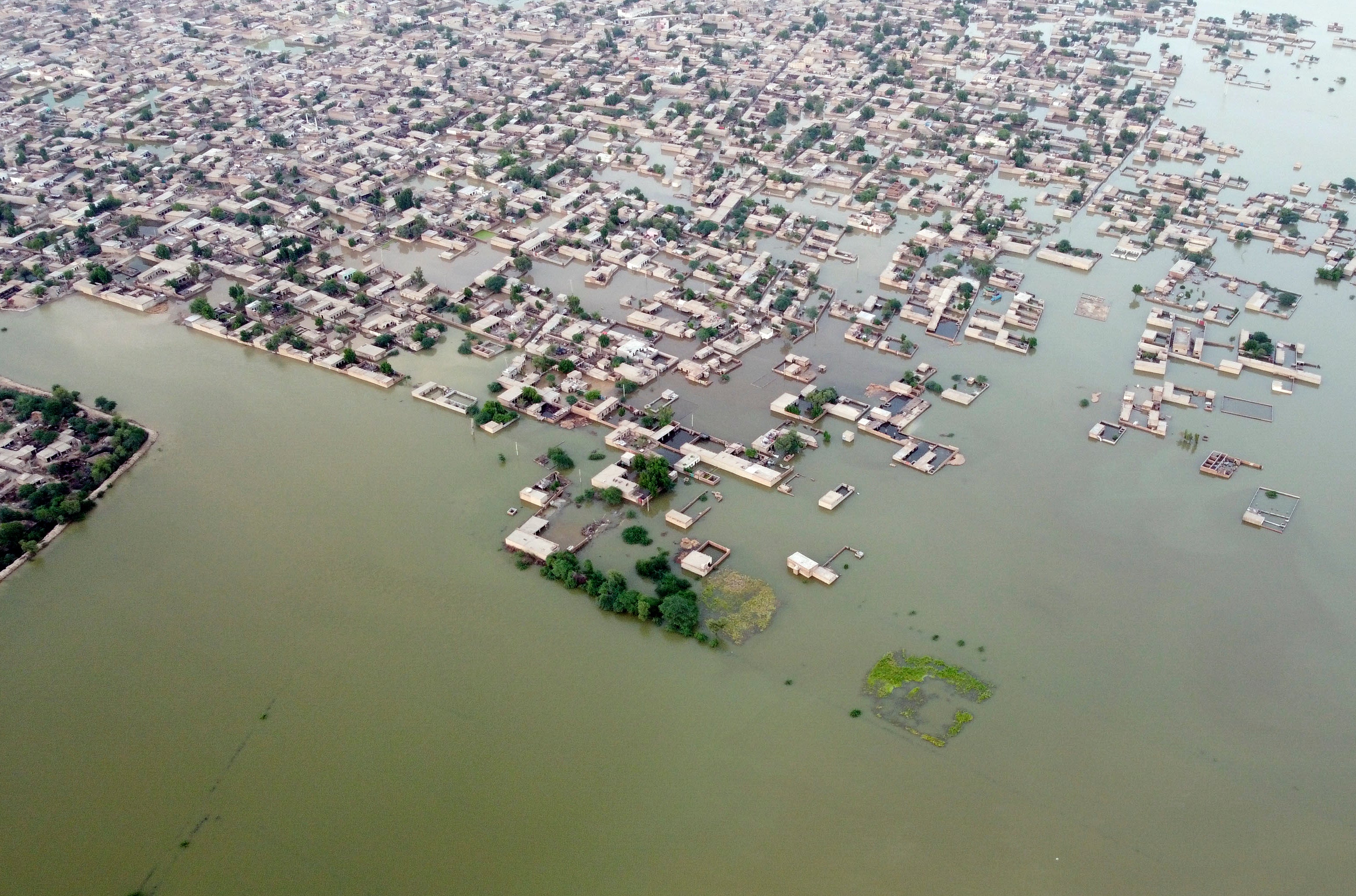 Homes surrounded by floodwaters in Jafarabad, a district of Pakistan's southwestern Baluchistan province in September following monsoon flooding