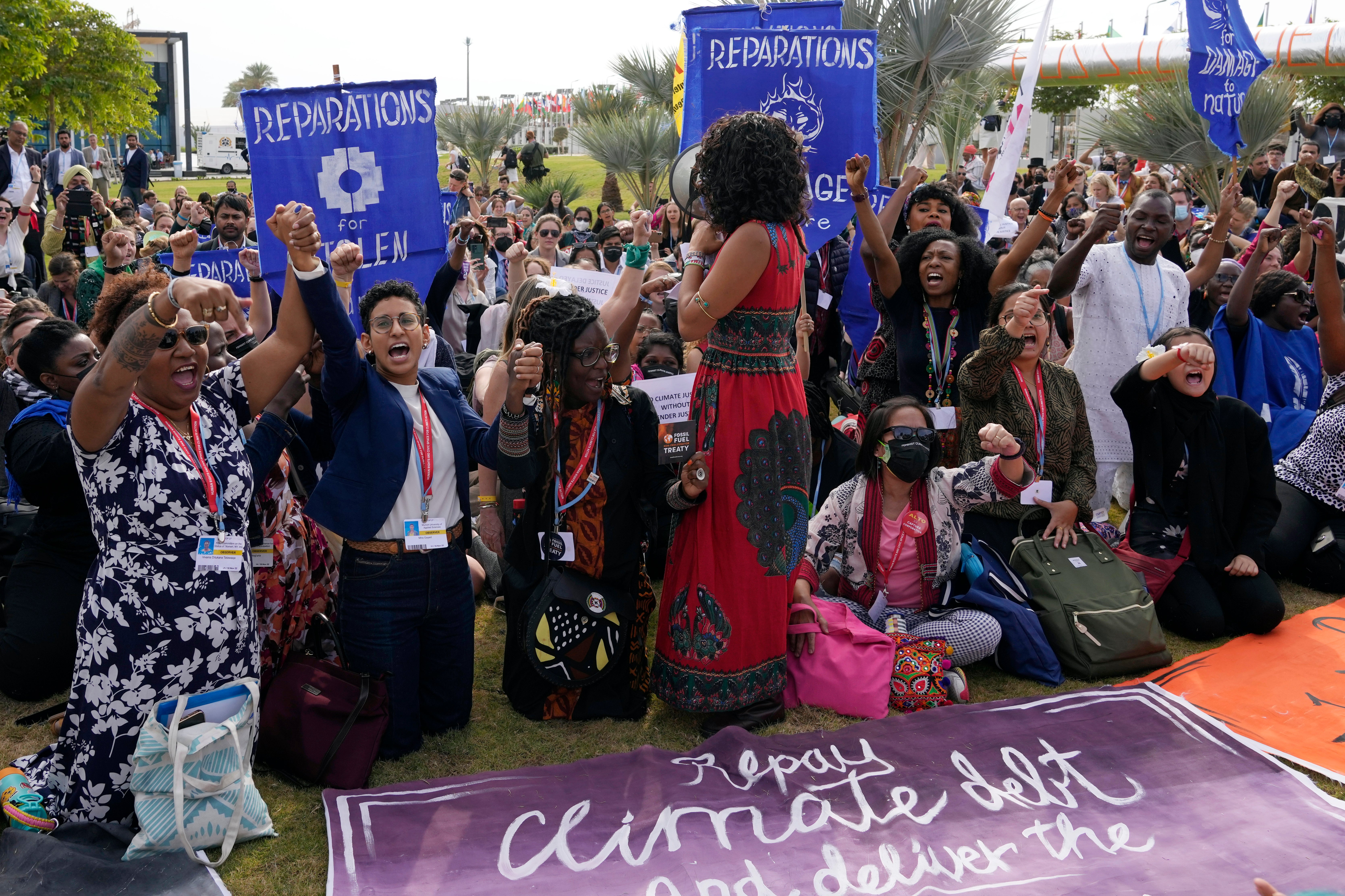 Demonstrators participate in a sit-in calling for reparations at the Cop27 UN Climate Summit